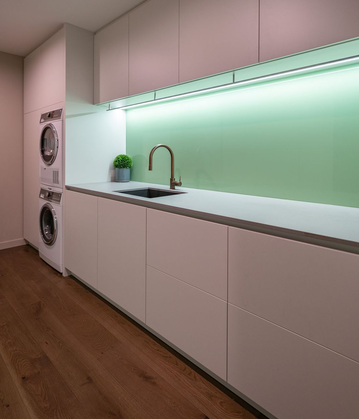 The laundry/utilities room is tucked downstairs behind the garage.