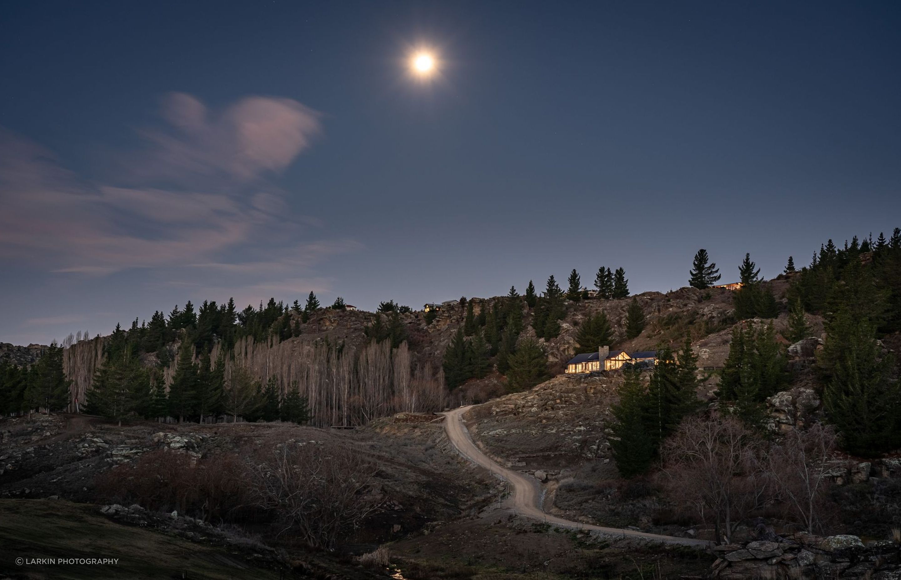 The winding journey from the road below up to the house builds a sense of suspense.