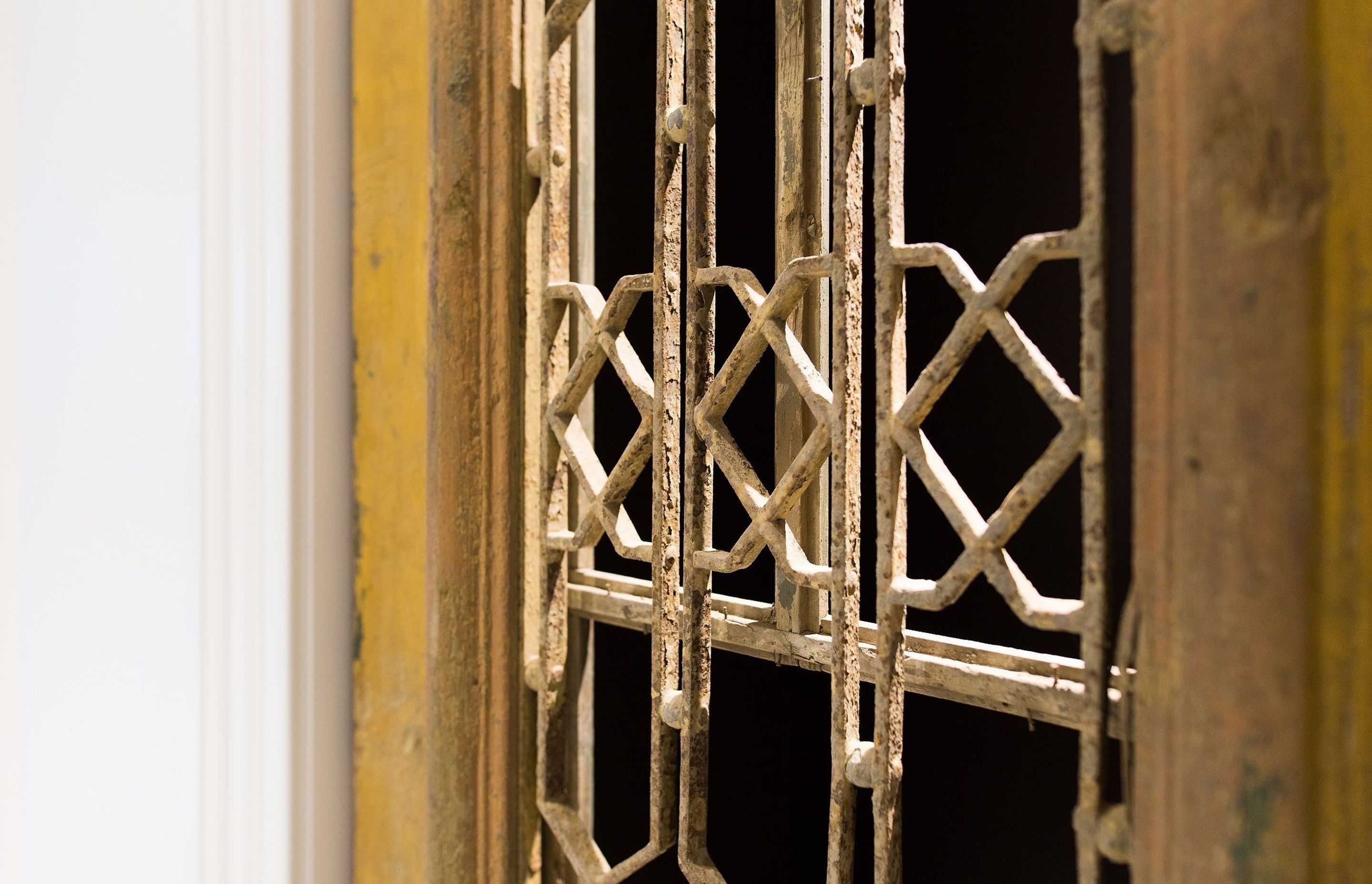 A pair of antique Egyptian villa doors adds a unique touch to the interior, imparting a sense of patina in an otherwise pared-back and refined scheme.