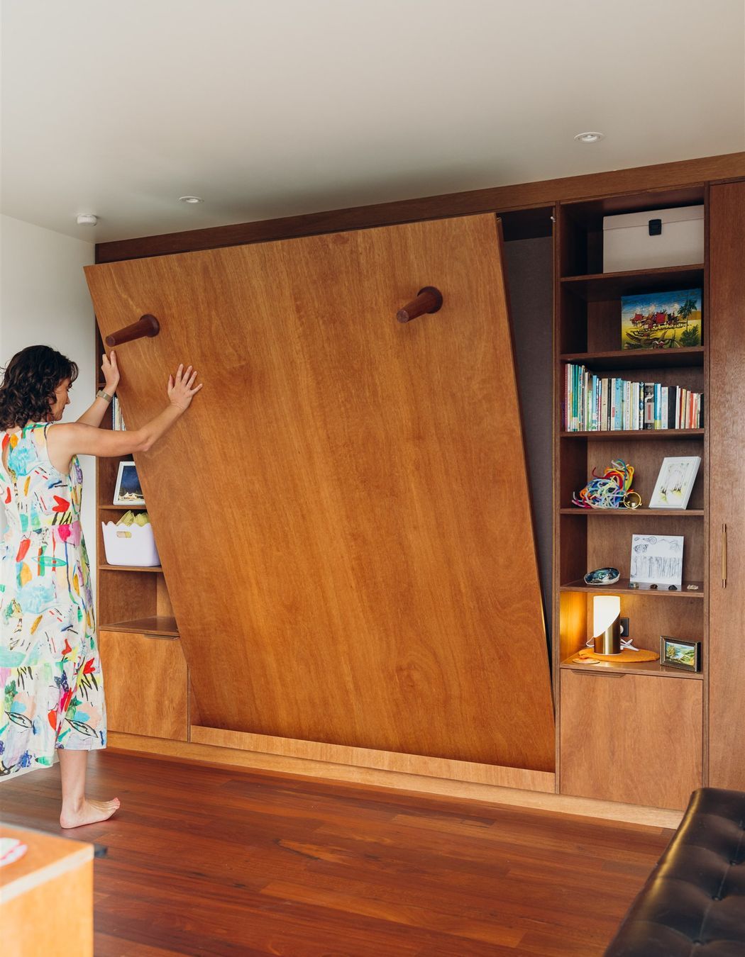 Solid Timber legs locate magnetically to the base of the fold down bed. With a gentle pull this becomes a queen size spare bedroom.