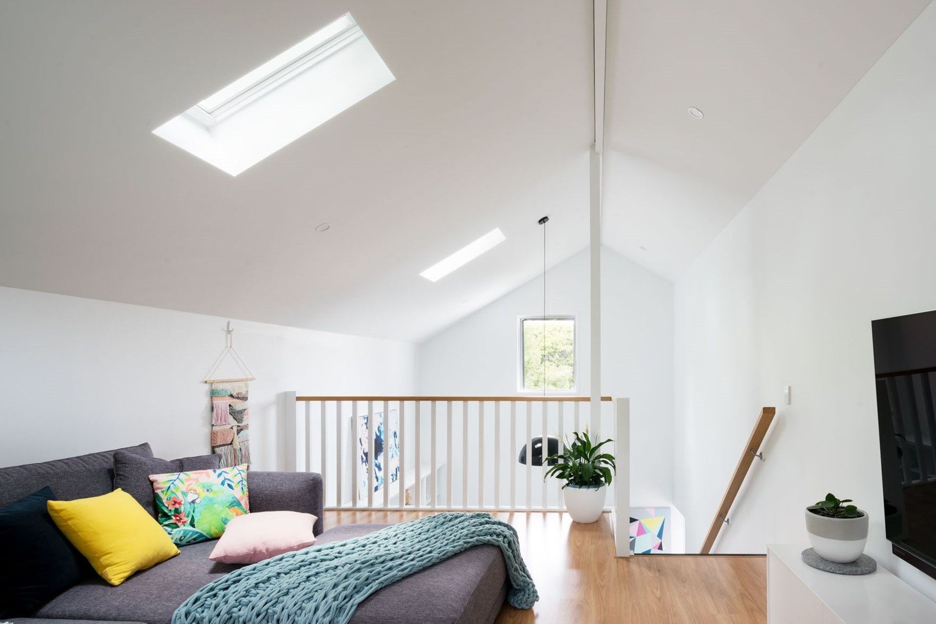The 'media room' is a multifunction loft space above the master suite, with operable roof windows to vent any accumulation of heat in summer and ceate a natural cooling draft through the new wing.