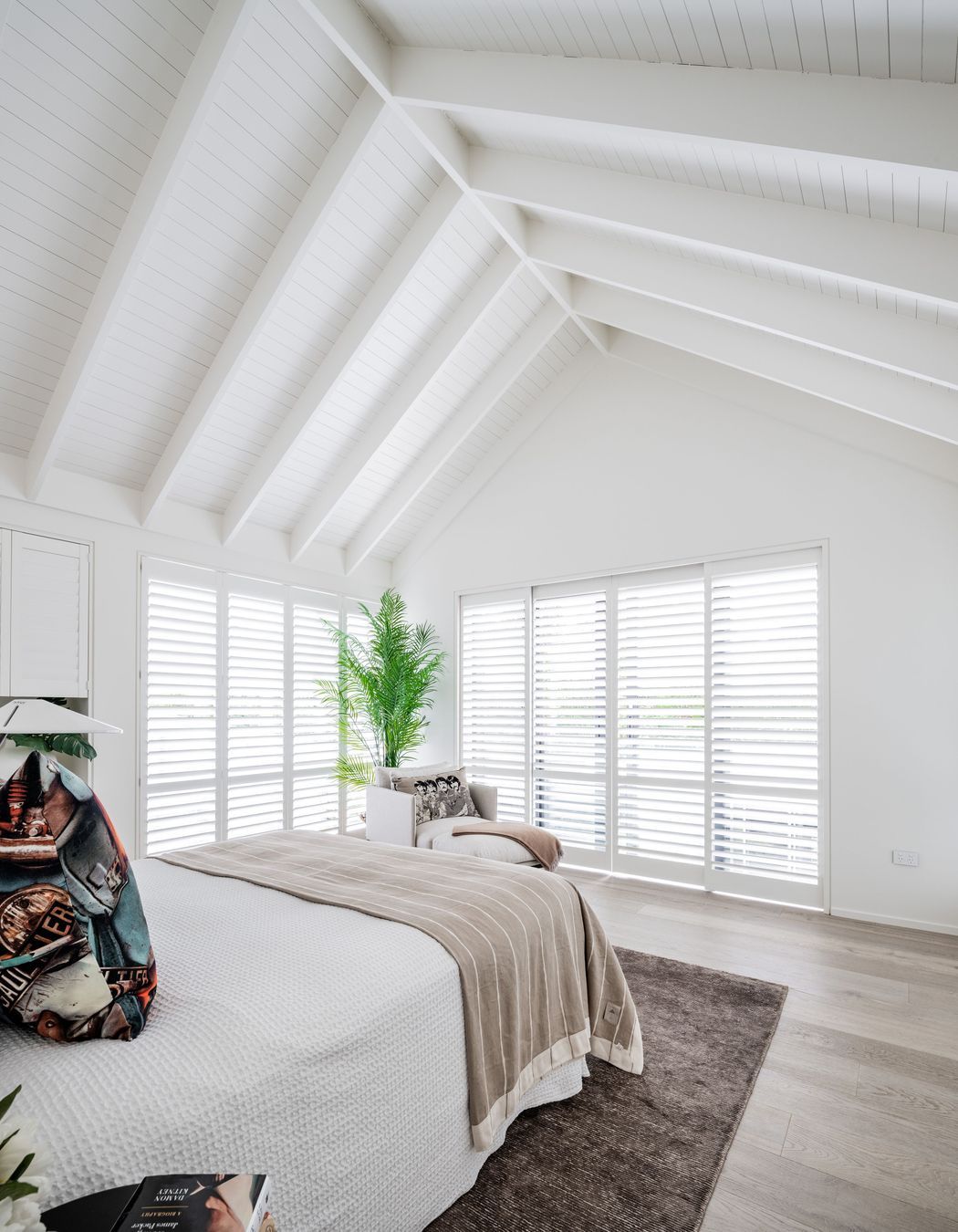 An upstairs bedroom makes the most of the gable form.