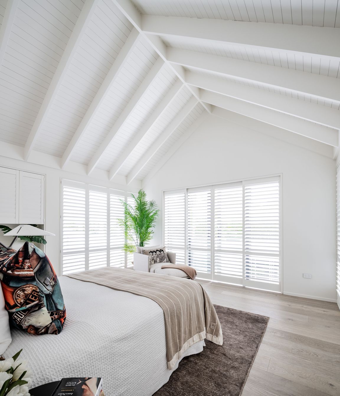 An upstairs bedroom makes the most of the gable form.