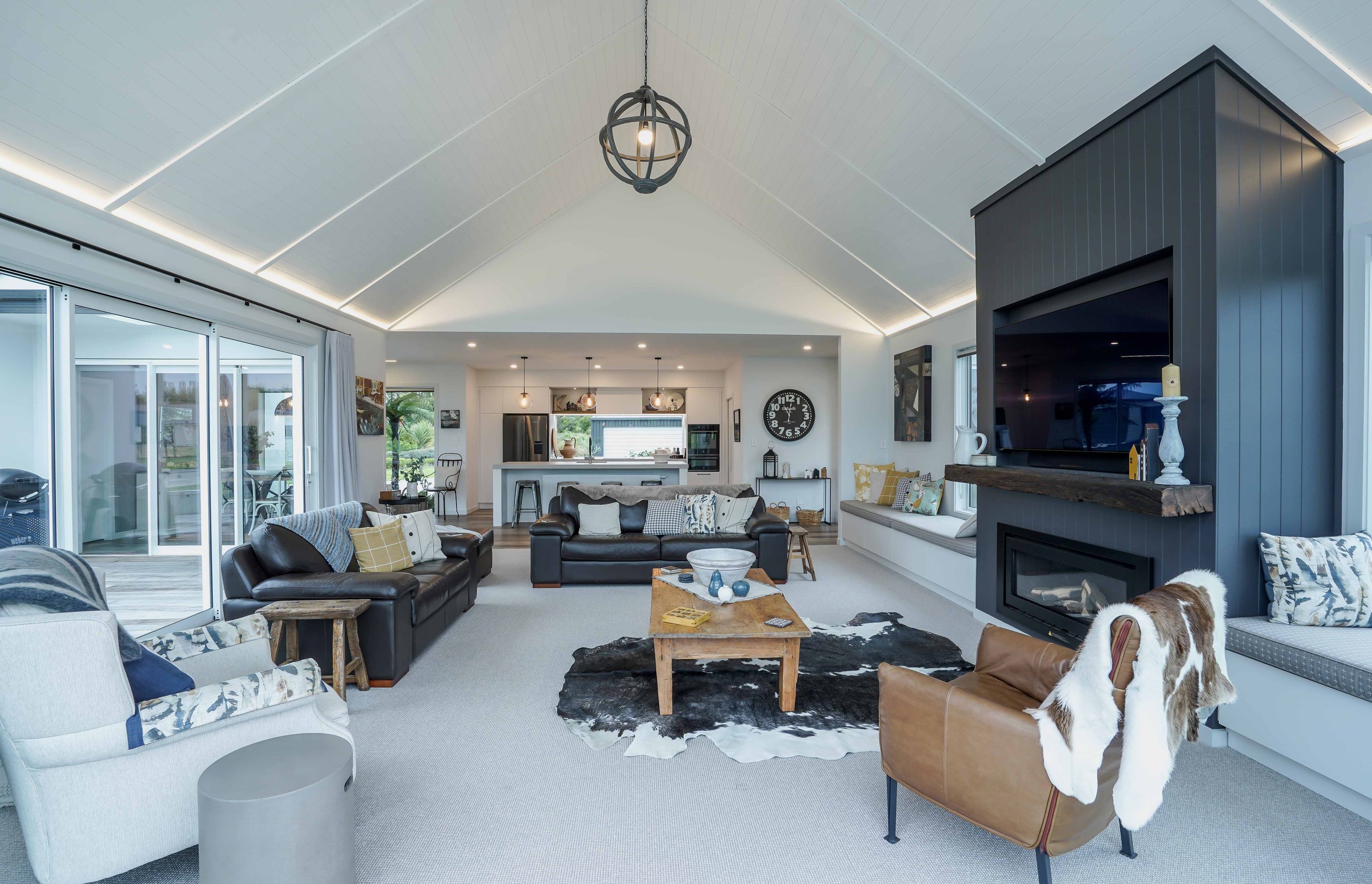 Exposed ceilings allowing the room to feel more spacious for this family home.