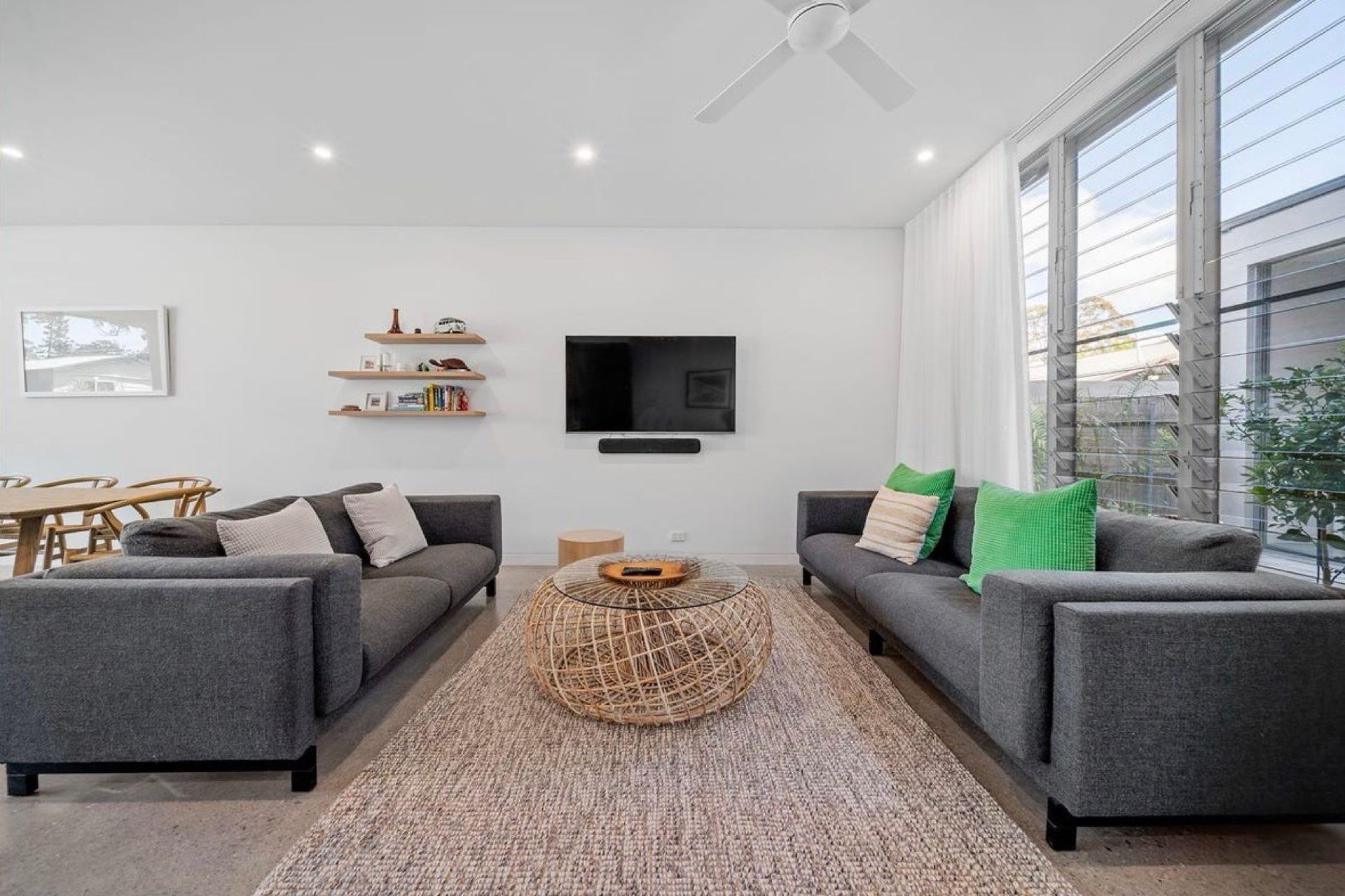 Generous proportions to the family lounge area with louvres providing the open connection-the difference between driving a sedan and a convertible