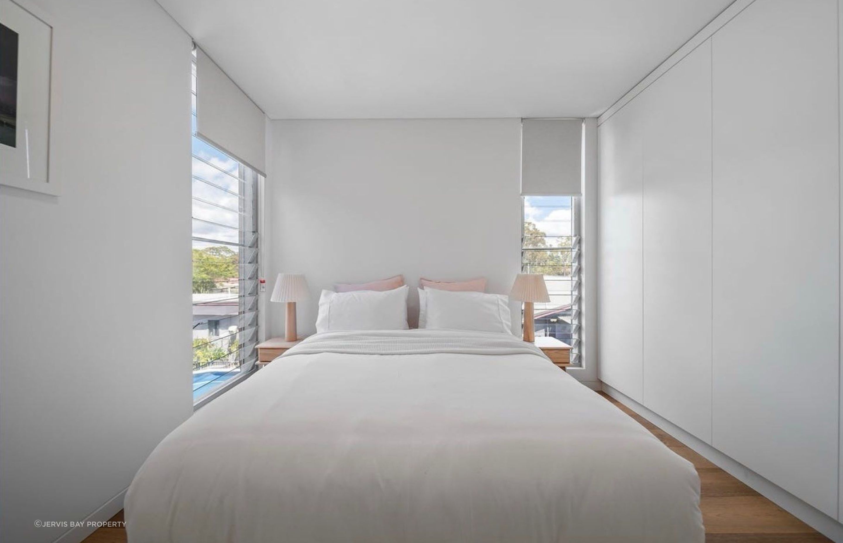 One of the four bedrooms per dwelling. Louvred windows allow for full crossflow ventilation
