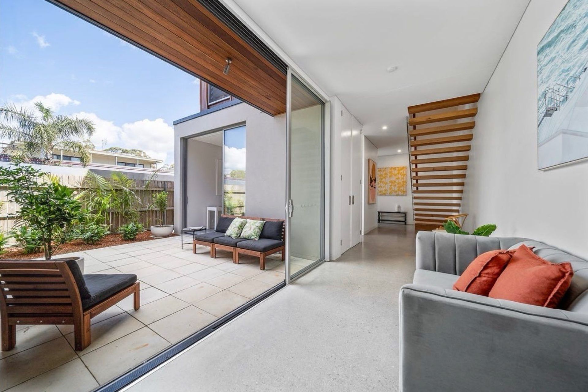 View to the front of the home with floating stairs