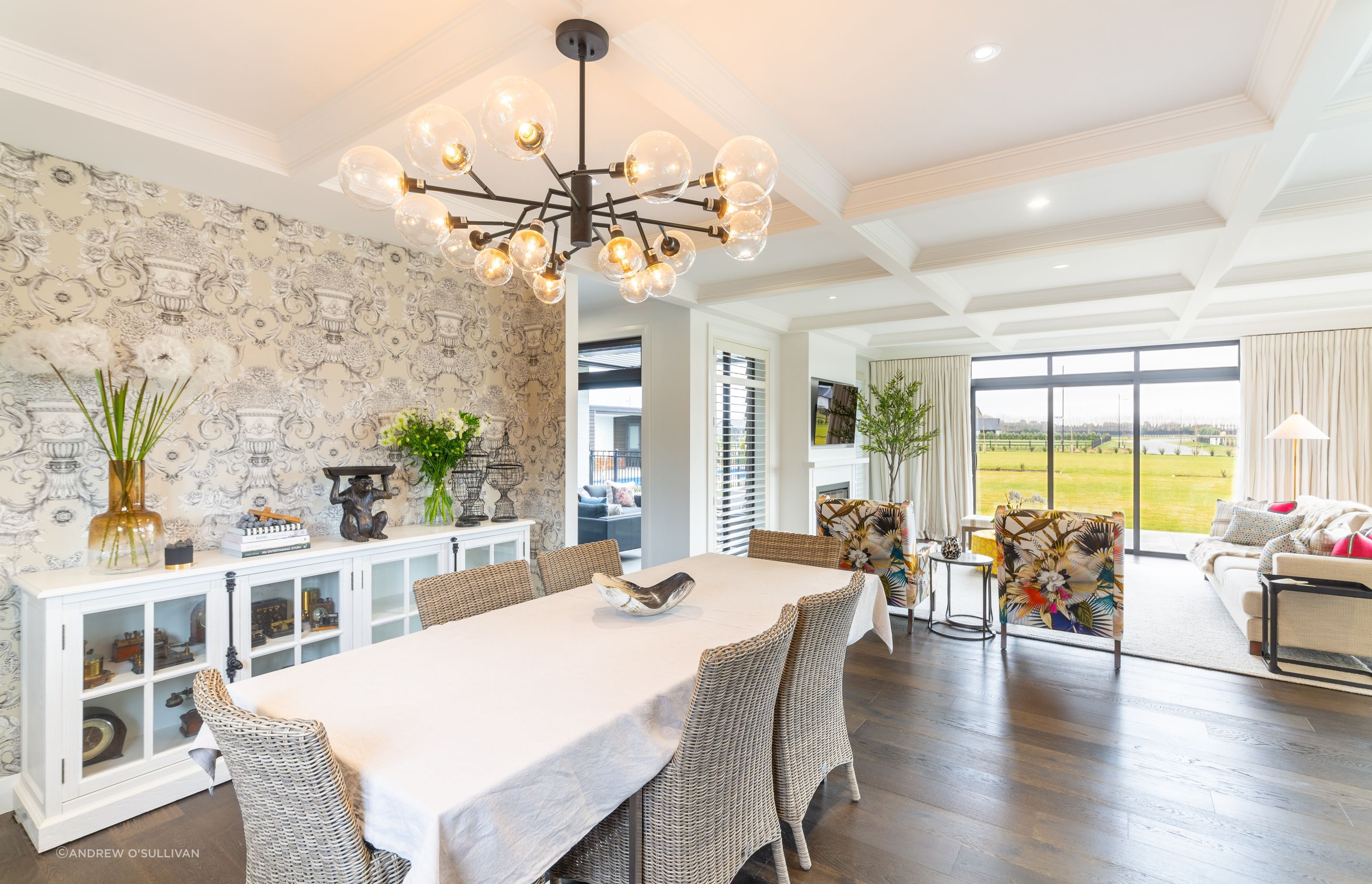 The open-plan kitchen/dining/living features engineered oak floorboards and ceiling details throughout.