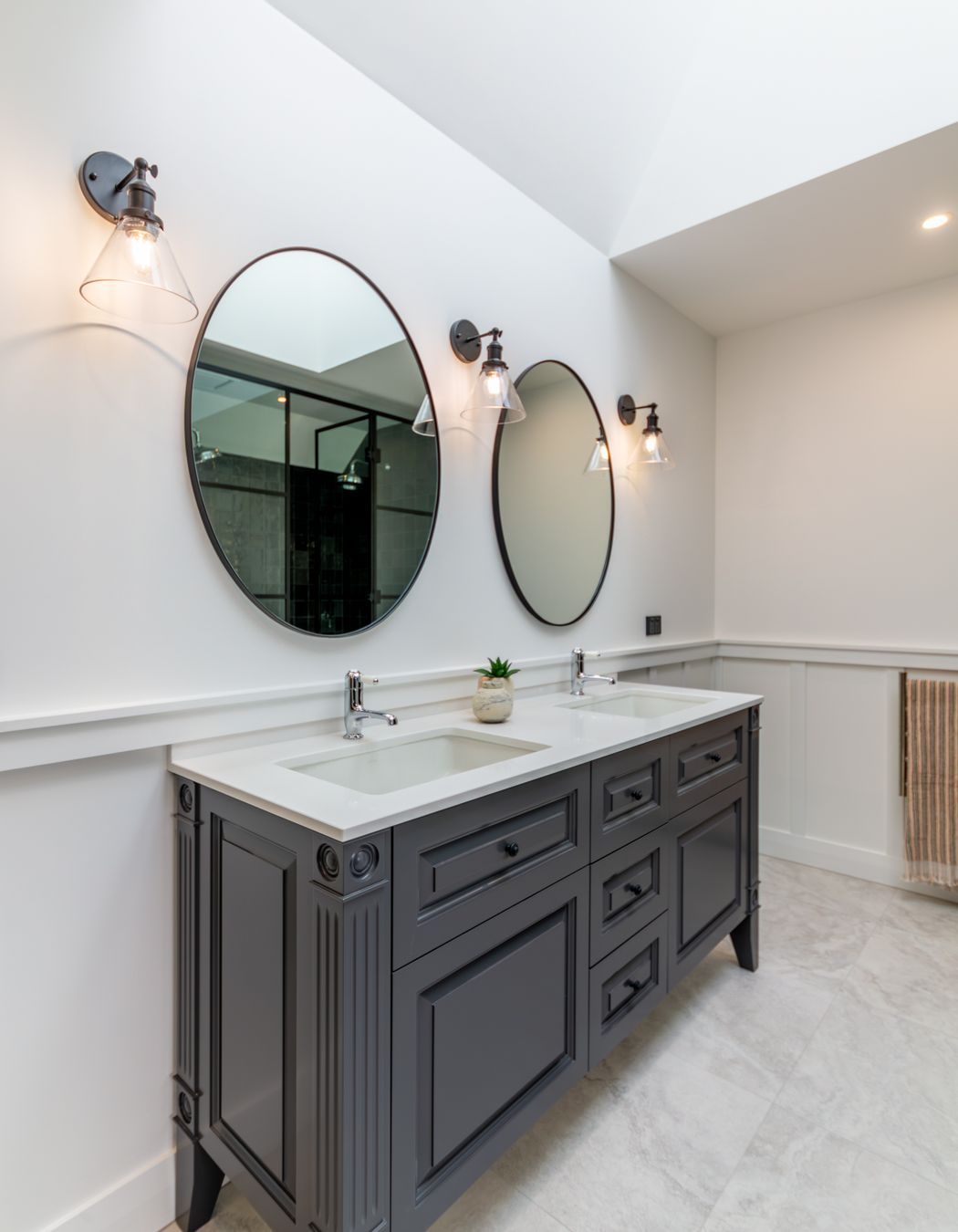Skylights let light into the master en suite. The character detailing is also extended into the bathroom spaces.