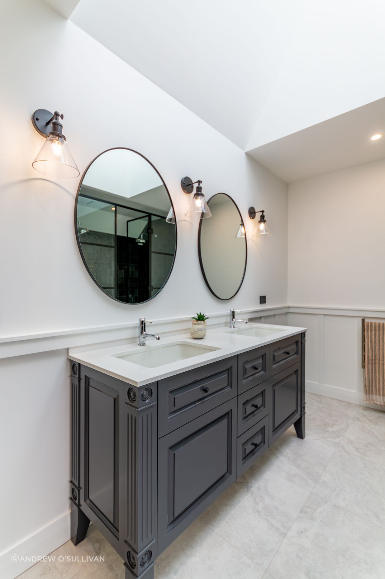 Skylights let light into the master en suite. The character detailing is also extended into the bathroom spaces.