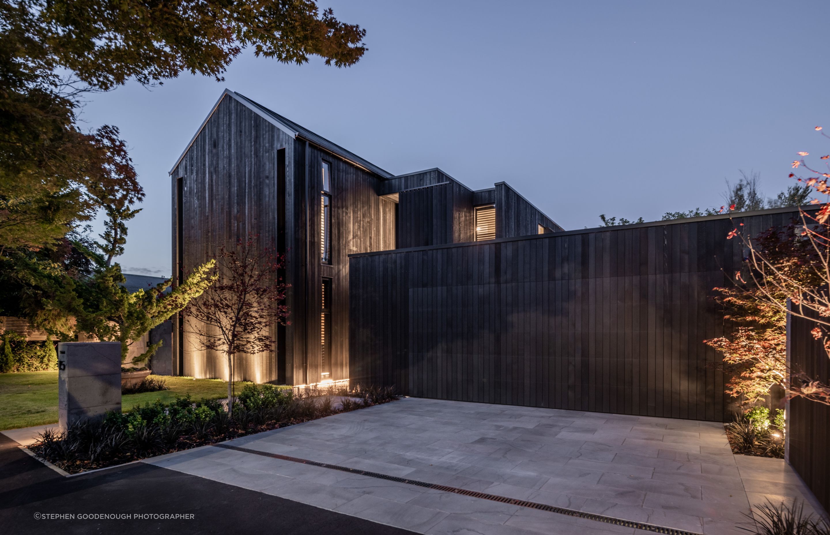 A dark exterior allows the Japanese maple trees and surrounding nature to be the focus.