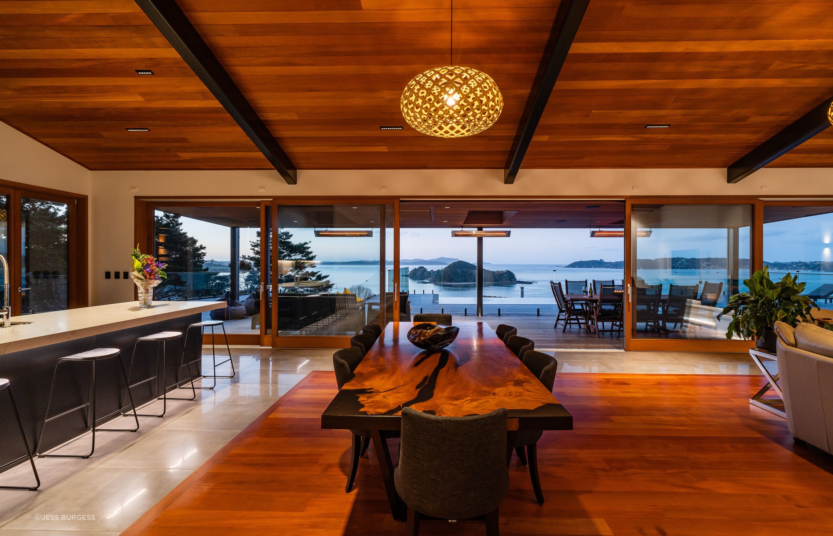 The wood for the inlay floor was sourced by the homeowner. The 13.5m doors were custom made by Optimal Windows. “They slide beautifully,” says Alan. On the ceiling are pinpoint Laser Blade downlights by iGuzzini that reduce glare.