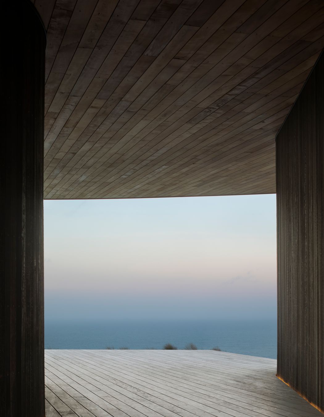A dreamy view of the mist is captured from the breezeway between the house and garage pods.