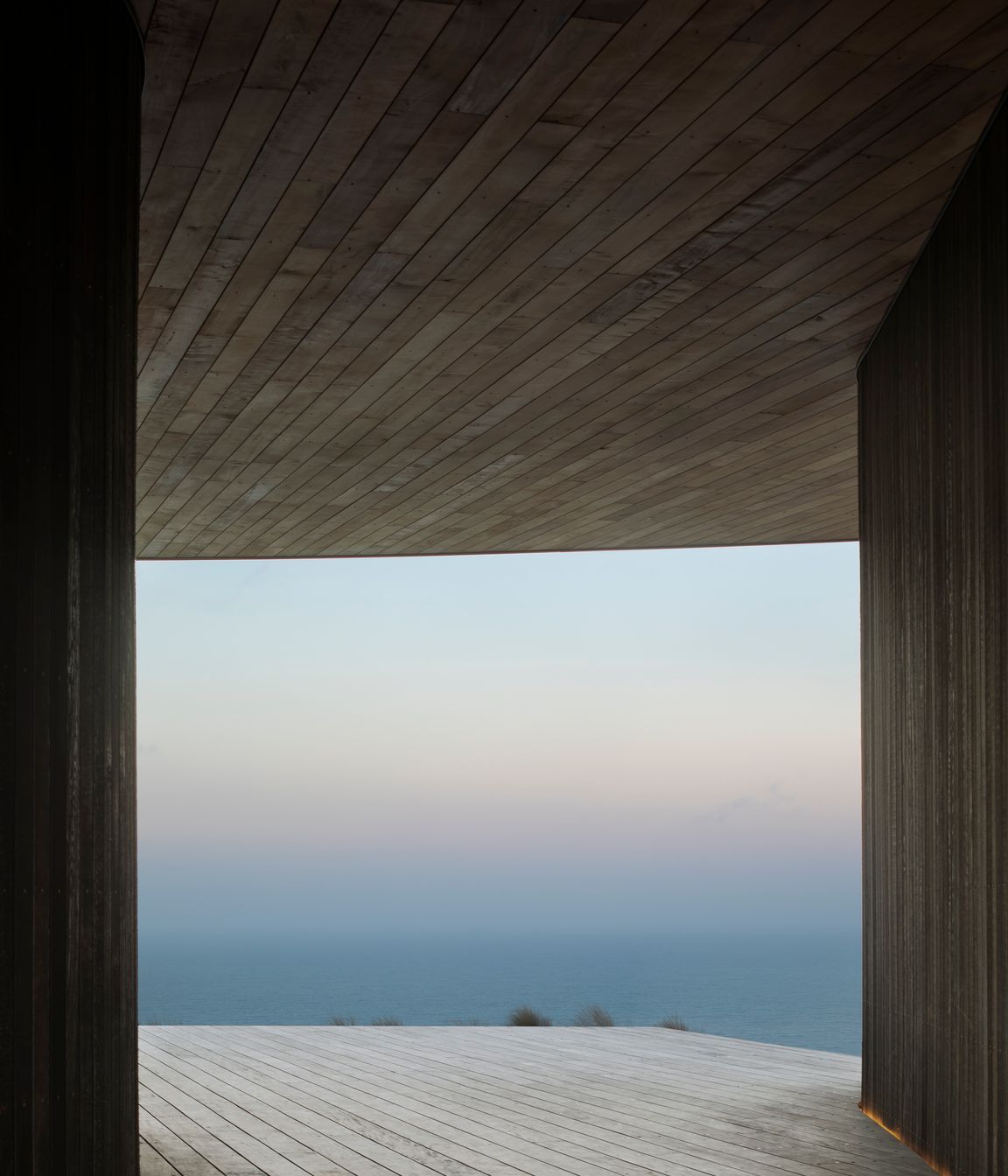 A dreamy view of the mist is captured from the breezeway between the house and garage pods.