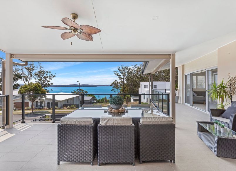 Two storey home overlook pool