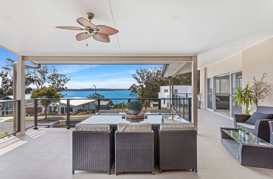 Two storey home overlook pool