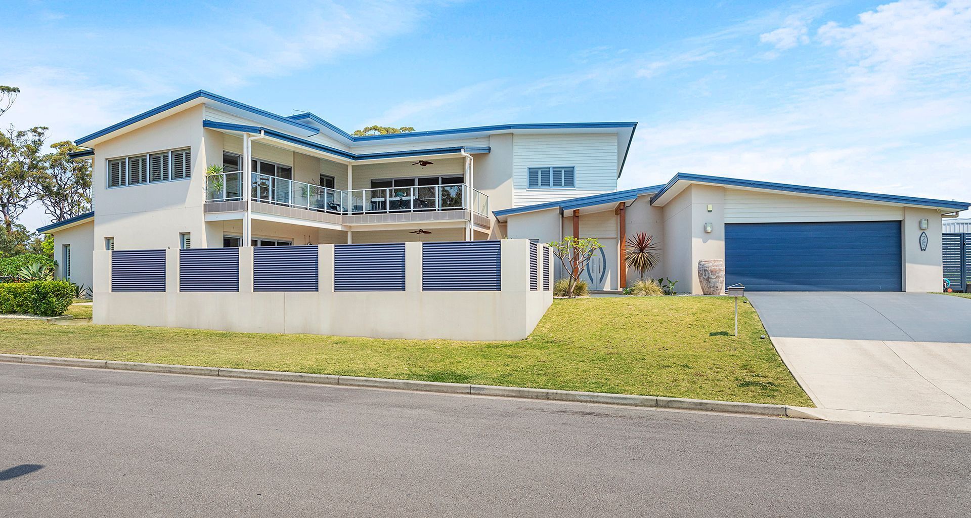 Two storey home overlook pool banner