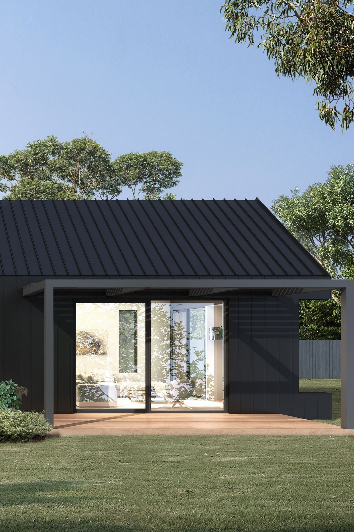  Skirted by a raised timber deck, Assemble House draws the external landscape within via glass sliding doors.