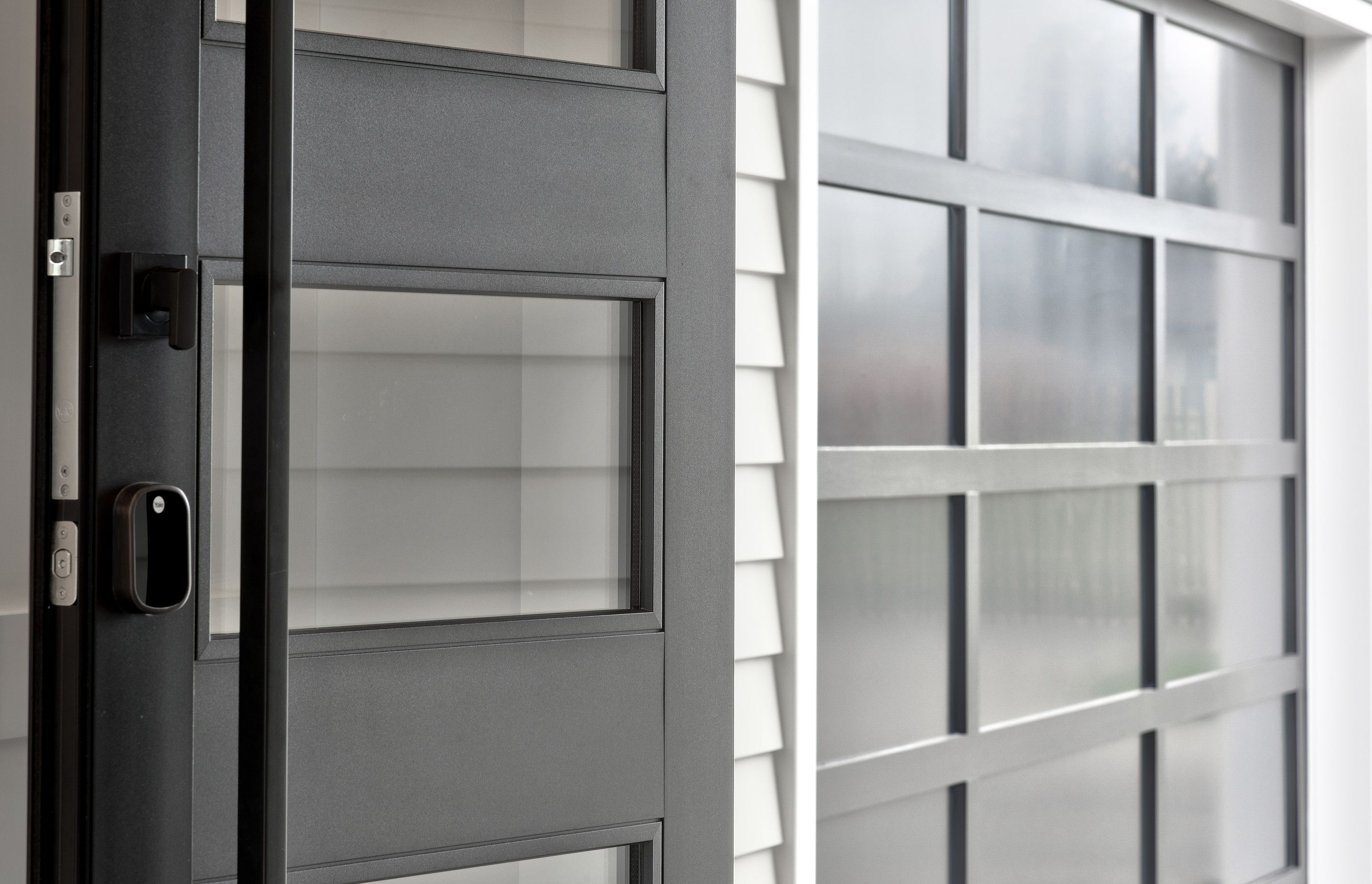 The materiality of weatherboard contrasting against metal, and dark against light, is an elegant juxtaposition.