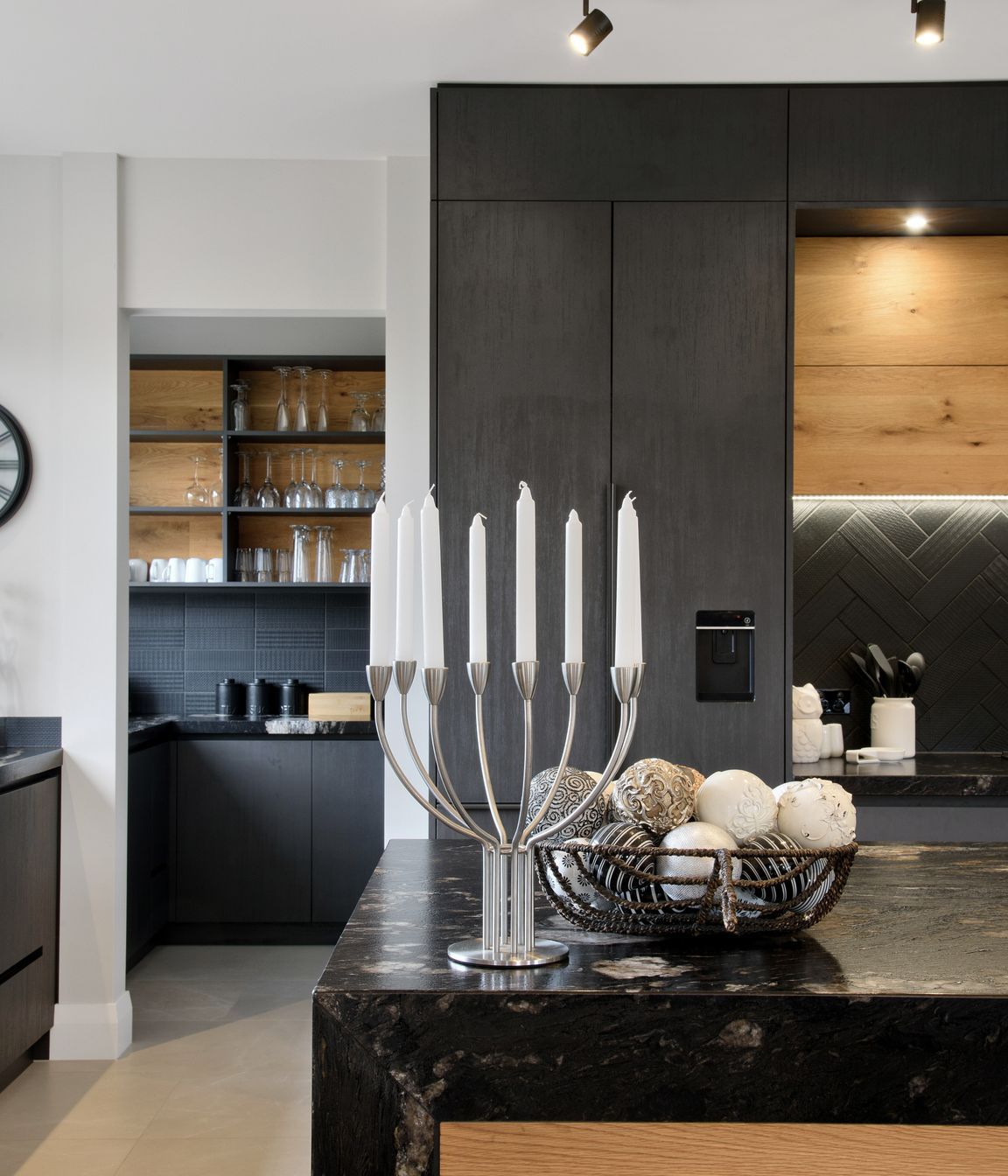 Behind the kitchen a luxurious scullery hides all of the mess.
