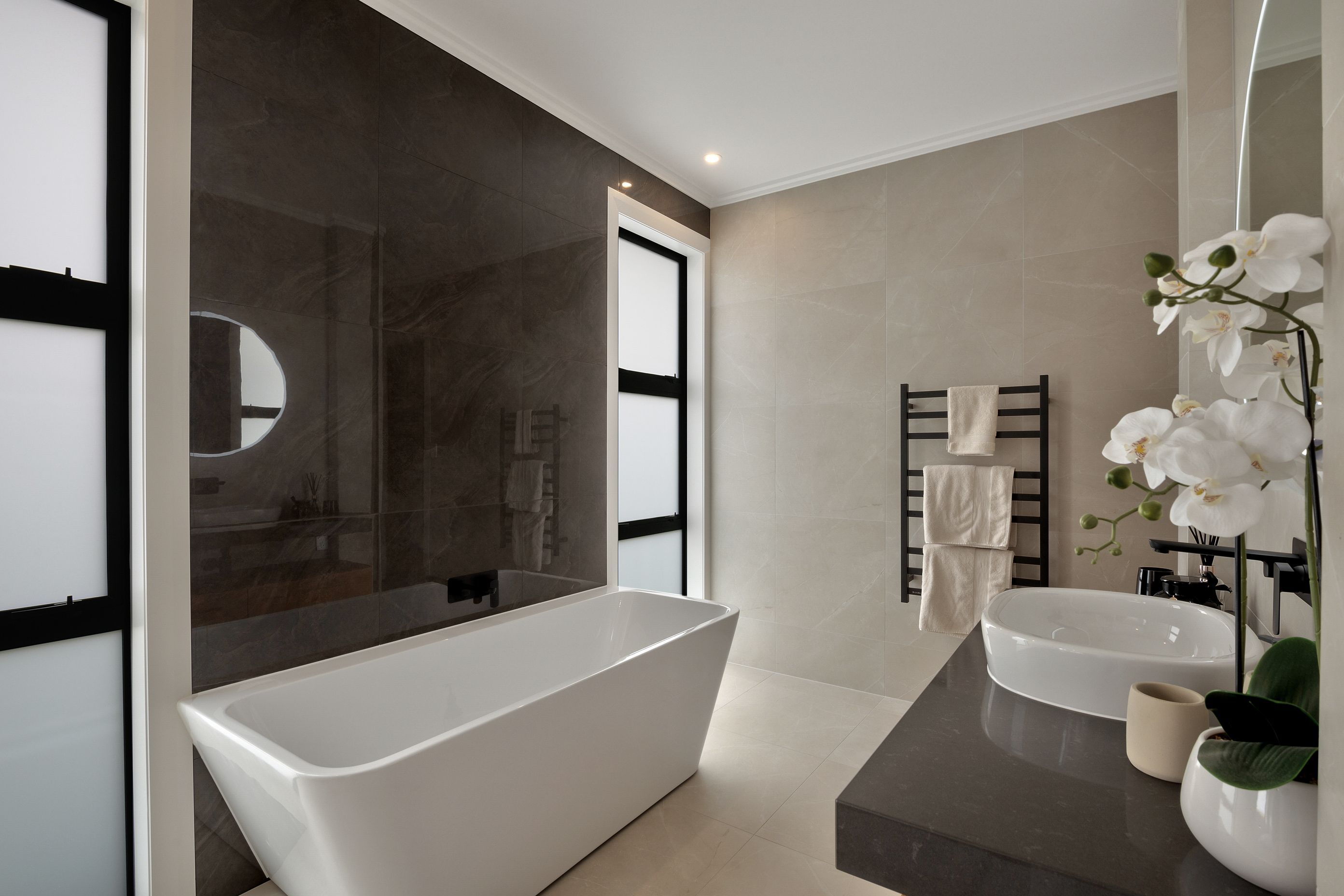 A freestanding bath is the feature piece of one of the bathrooms.