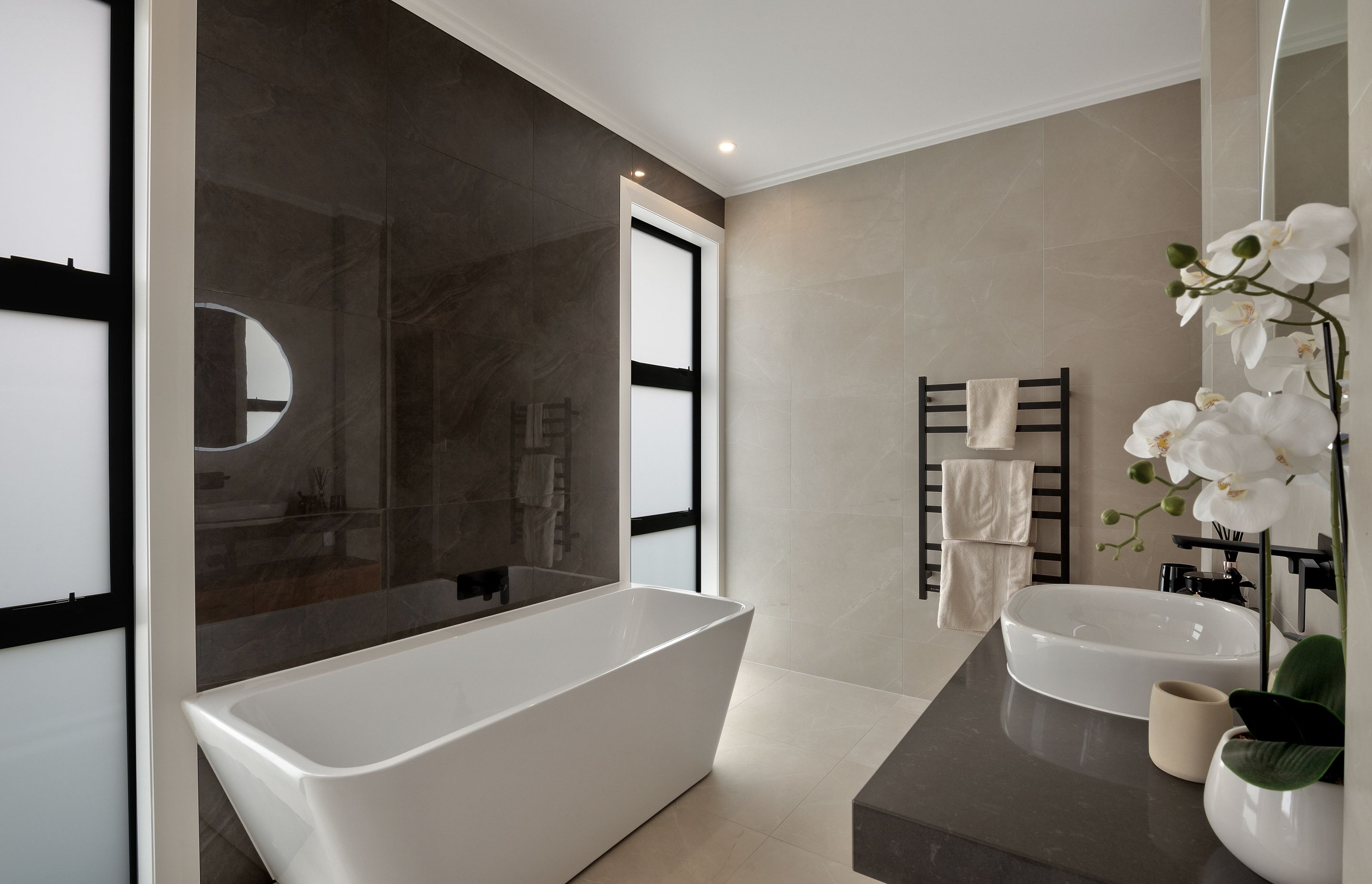 A freestanding bath is the feature piece of one of the bathrooms.
