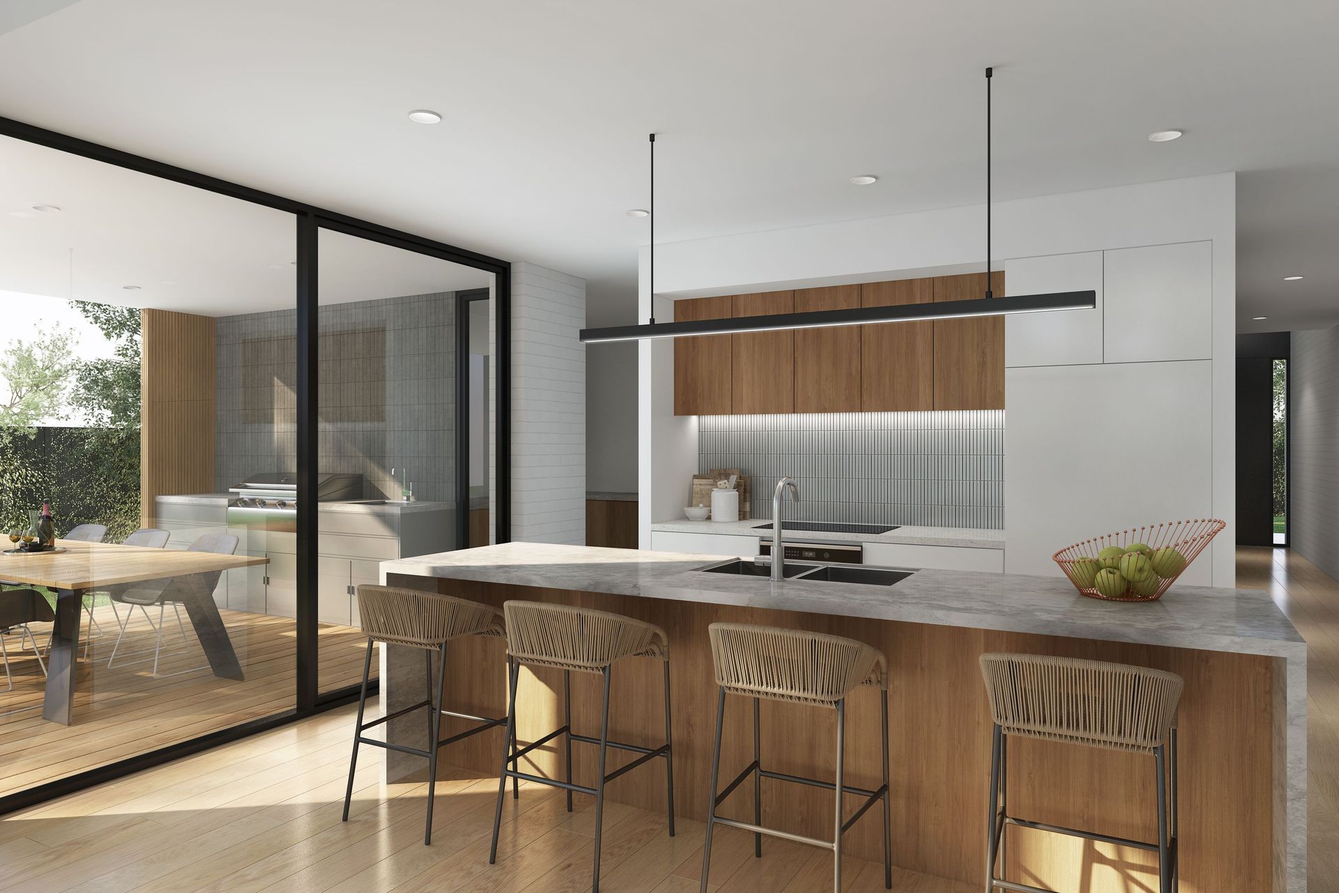 A central aspect of the shared living space, the open plan kitchen and dining area offer a multi-purpose, freeflowing environment that caters to all facets of family life. The kitchen is a blend of functionality and style, with timber veneer cabinetry, a central stone island bench and contemporary pendant lighting. The sleek European appliances are seamlessly integrated and the storage solutions intuitive. Dining can be enjoyed inside or out, with sliding glass doors leading smoothly to the terrace beyond.