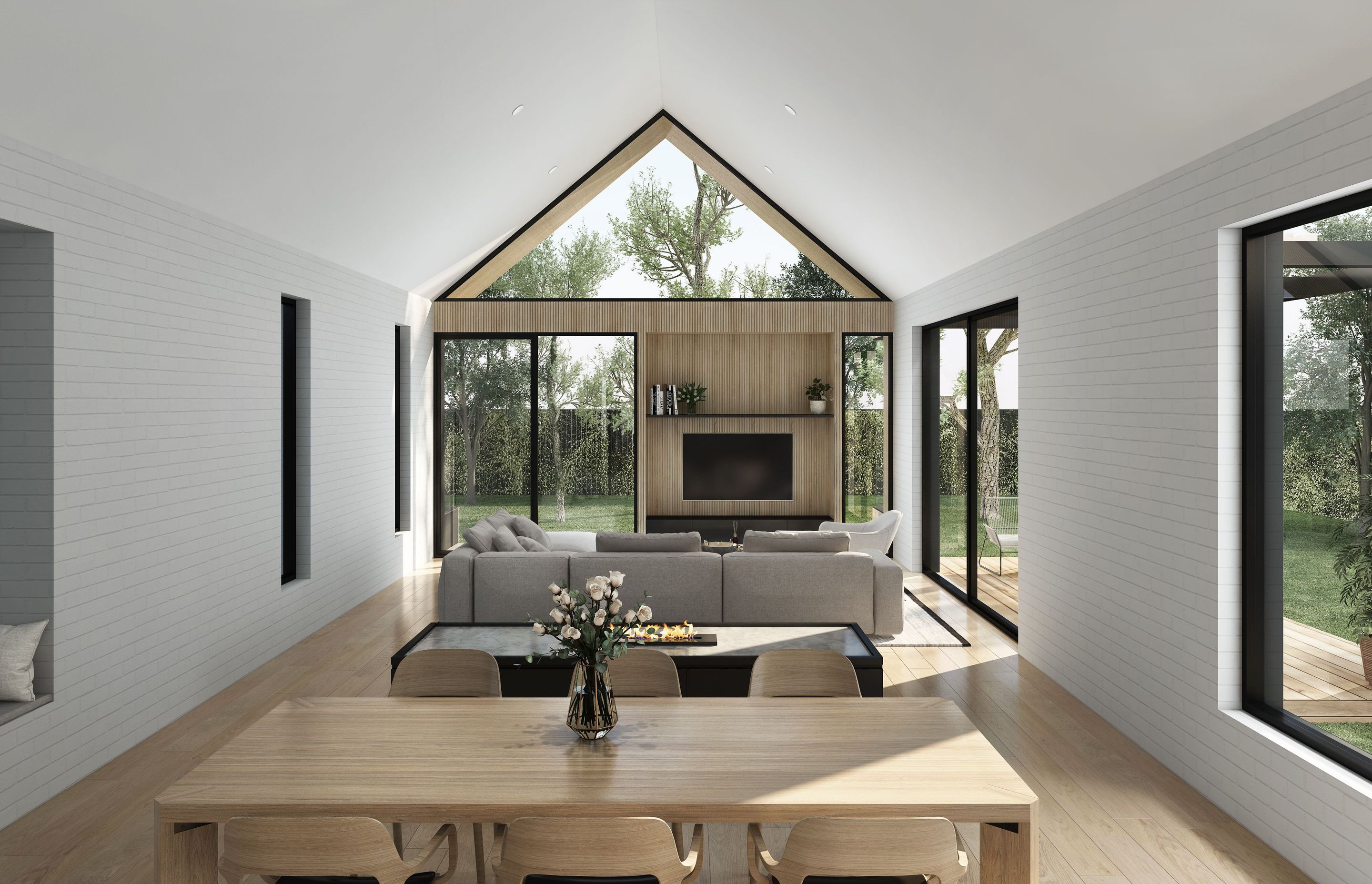 A cavernous, pitched ceiling opens up the central living area, with a neutral material palette of painted white brick and timber used throughout.