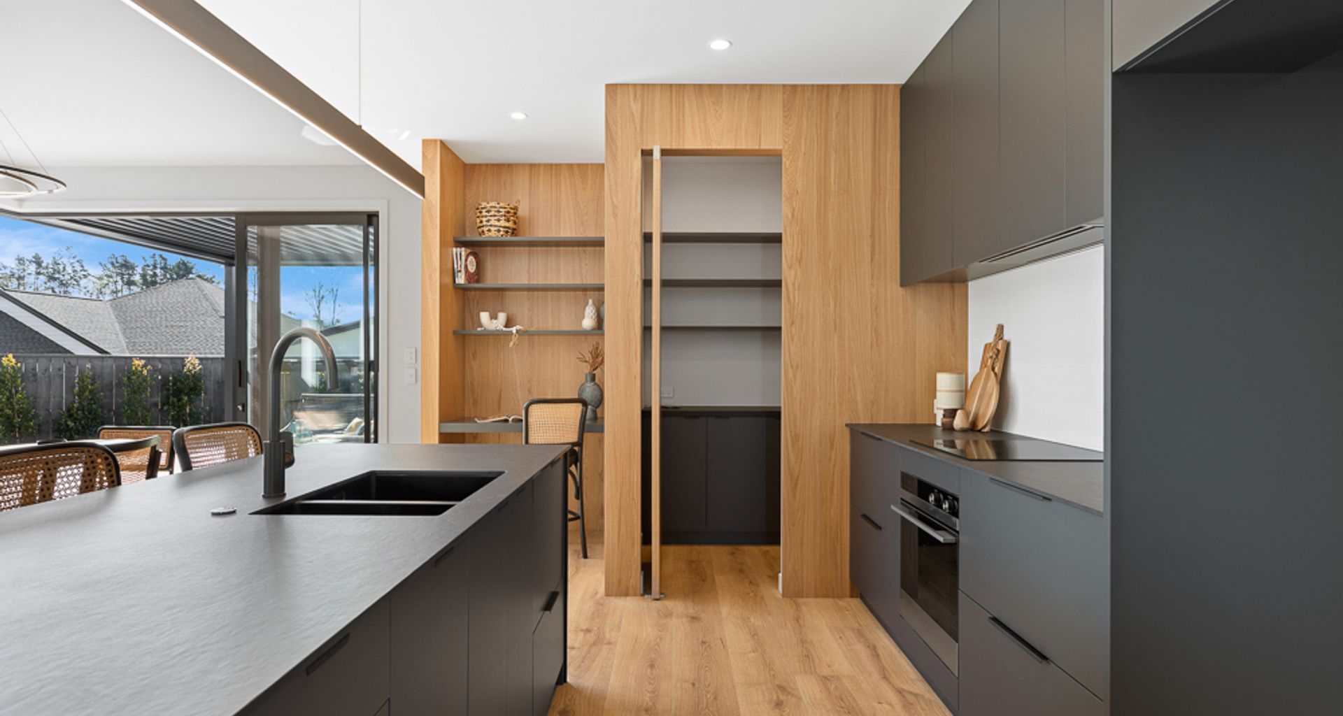 Black steel Kitchen Island with Dekton + Oak banner