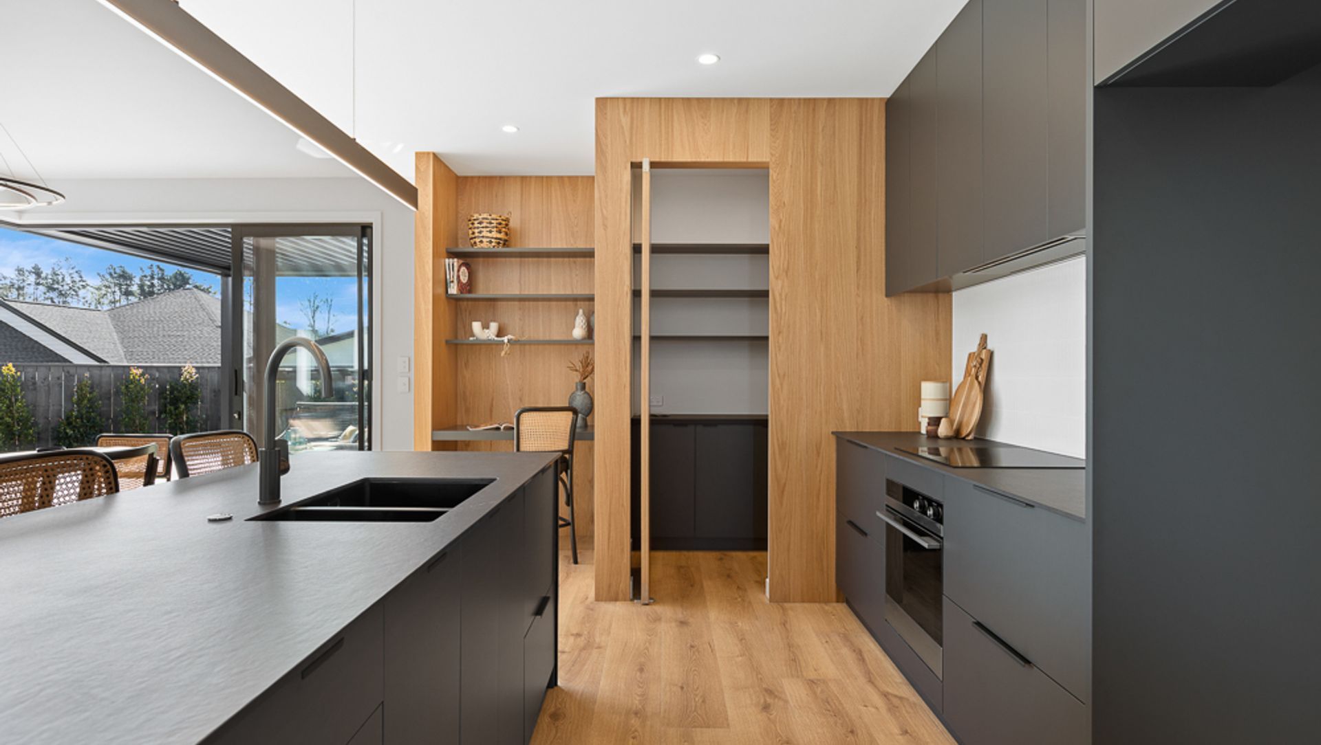 Black steel Kitchen Island with Dekton + Oak banner