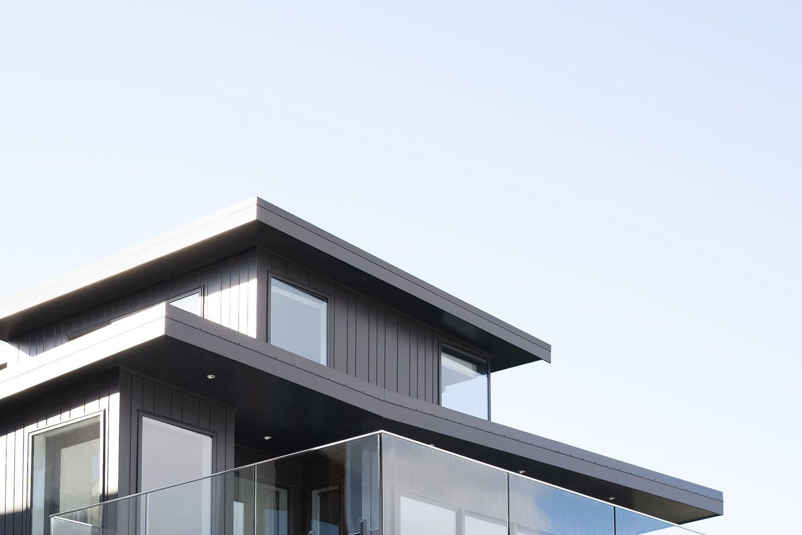 The bold roof line forms cut a sharp contrast through the sky as viewed from the road