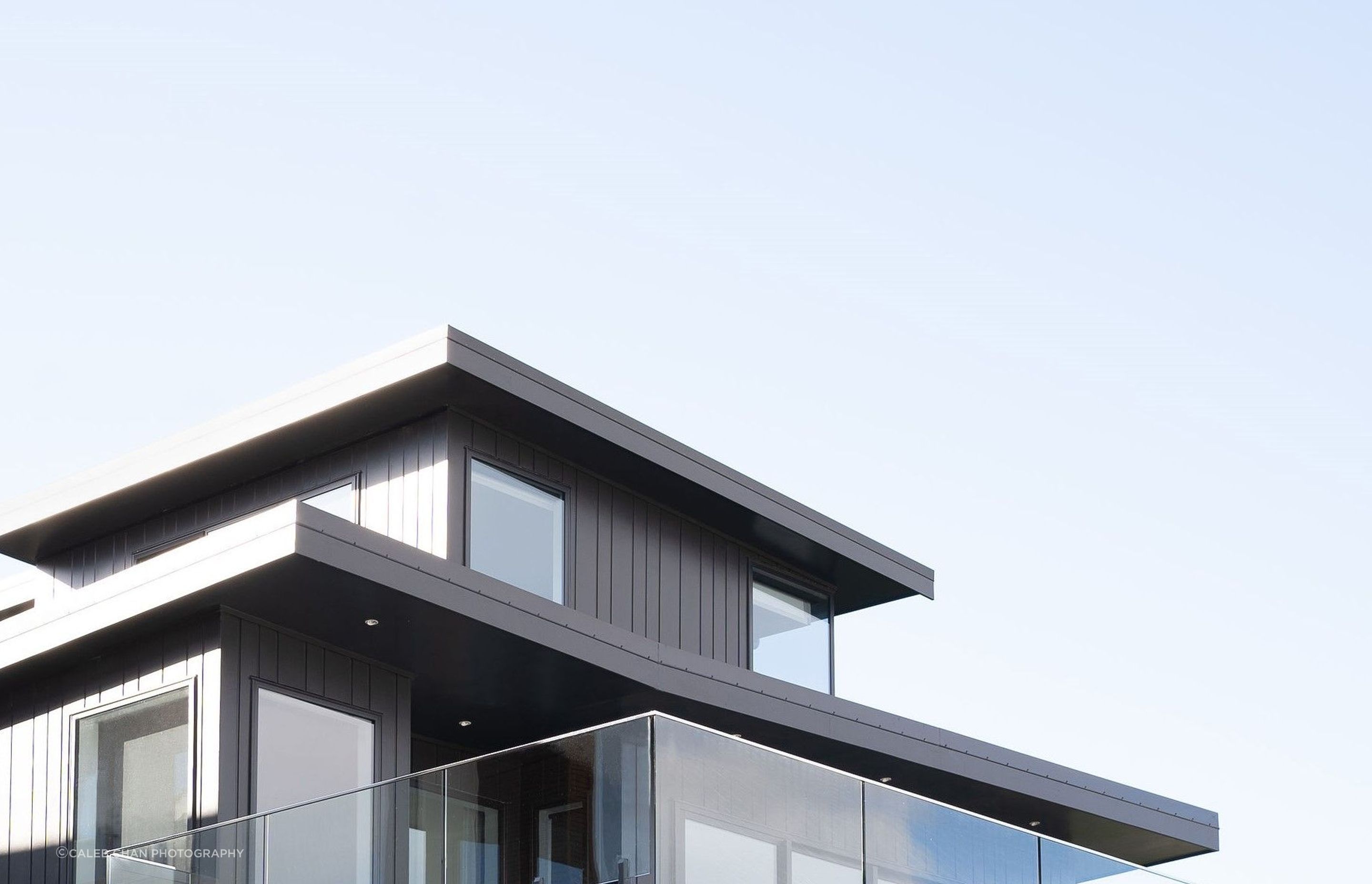 The bold roof line forms cut a sharp contrast through the sky as viewed from the road