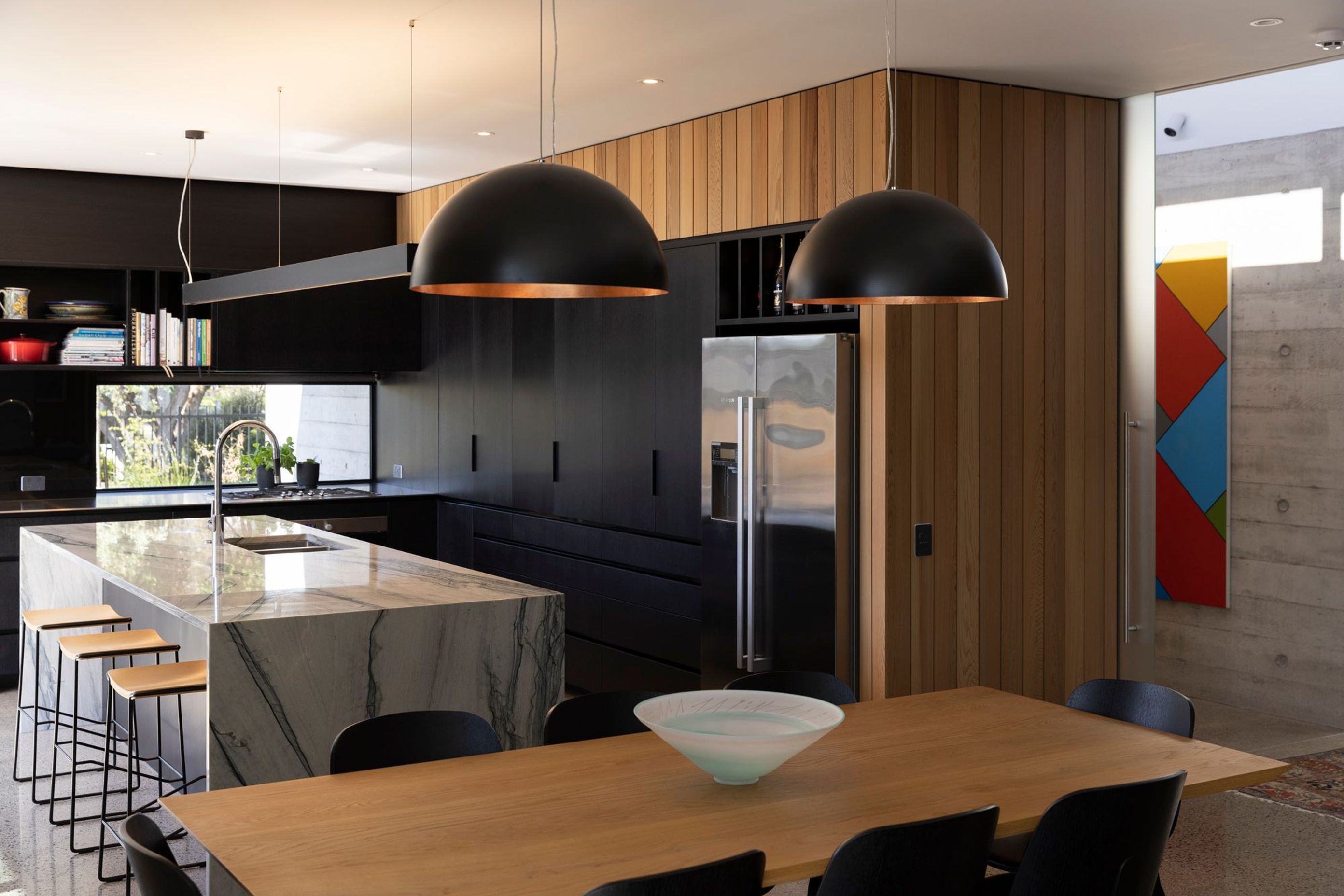 The client requested a black kitchen, says Richard, and they sourced their own stone for the benchtop. The tapware is by Dornbracht and the sink is Burns & Ferrall.