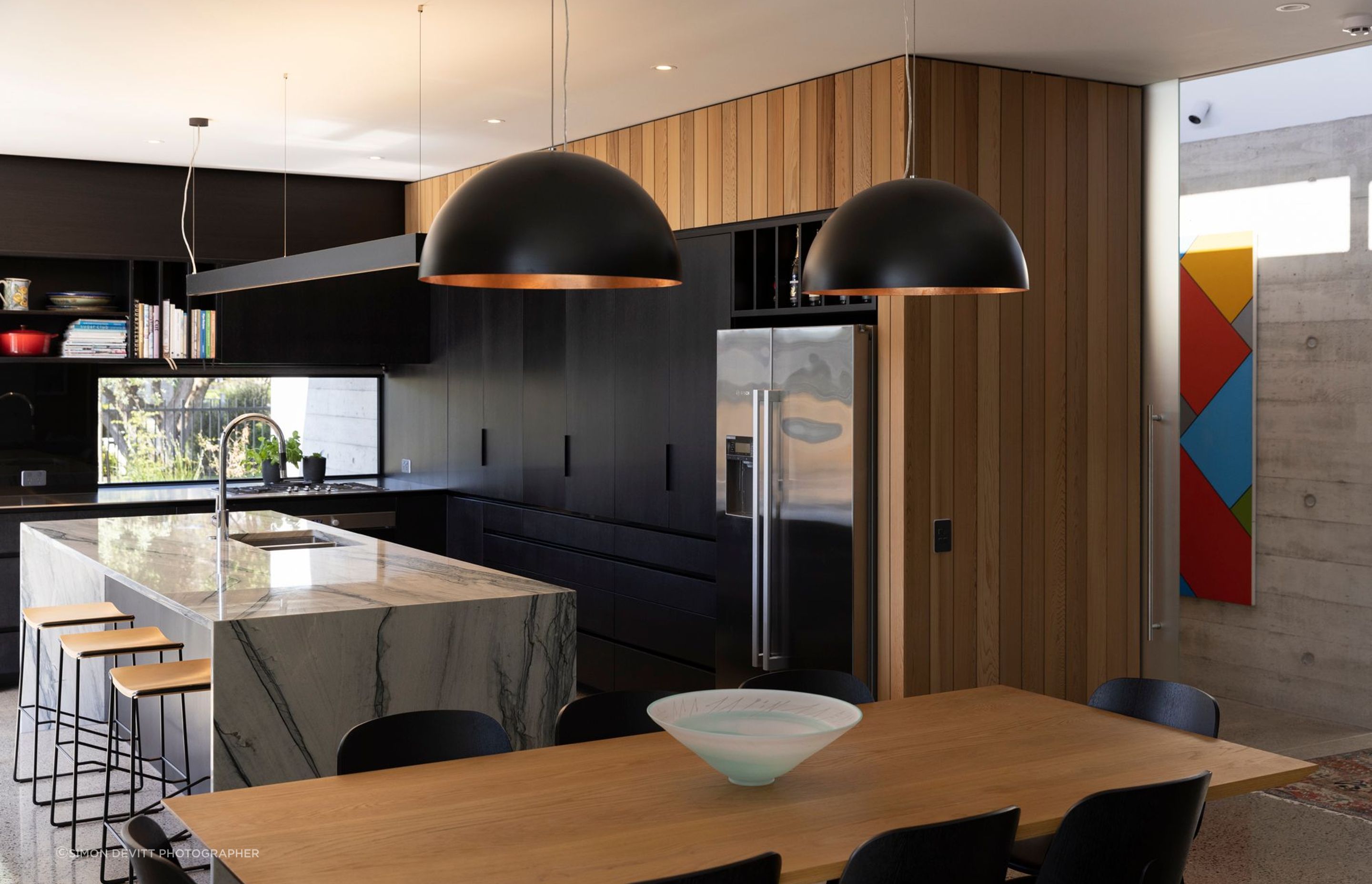 The client requested a black kitchen, says Richard, and they sourced their own stone for the benchtop. The tapware is by Dornbracht and the sink is Burns & Ferrall.