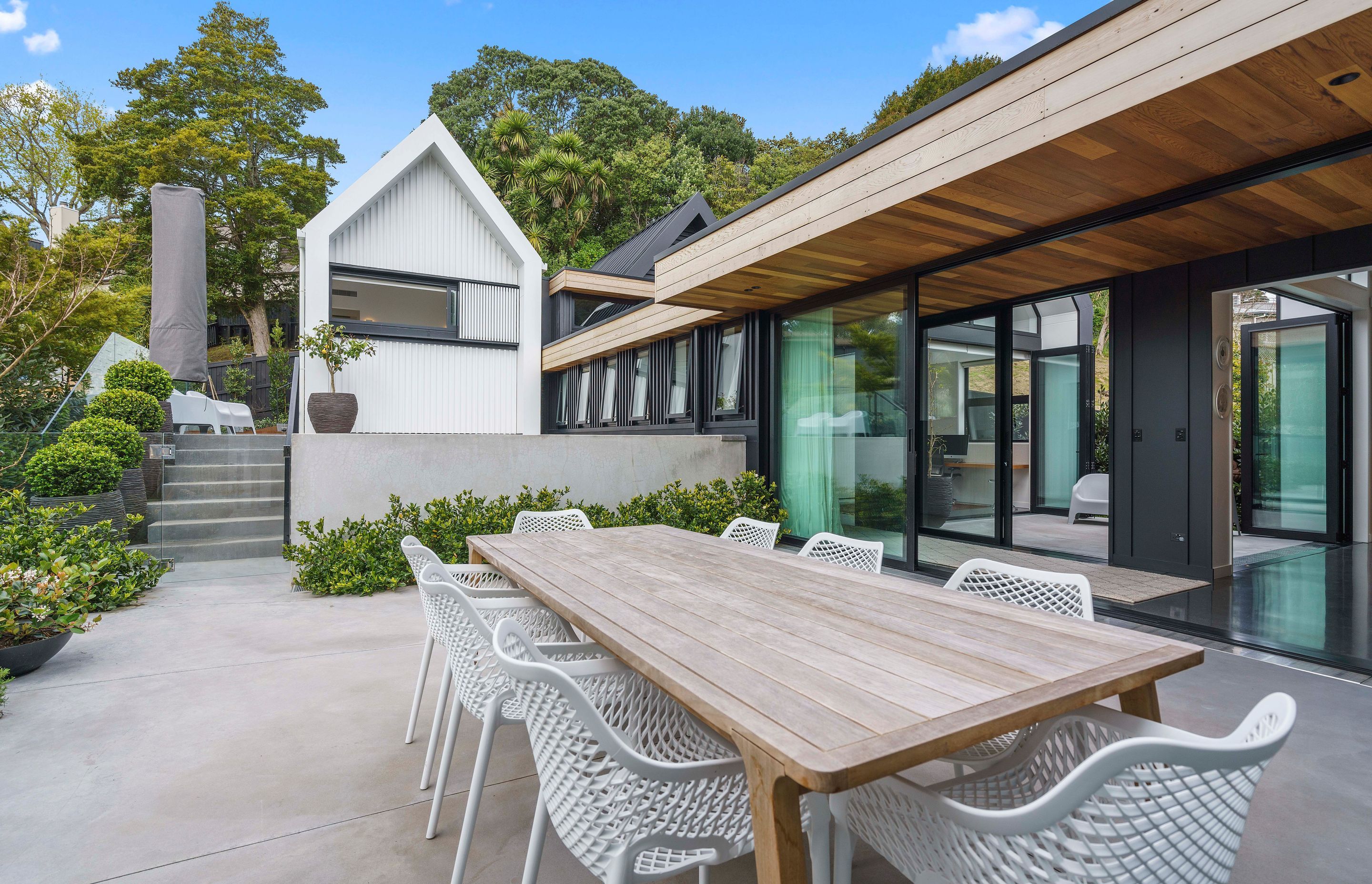 Following the contour of the site, steps lead up from the courtyard to the custom swimming pool and the two bedroom pavilions.