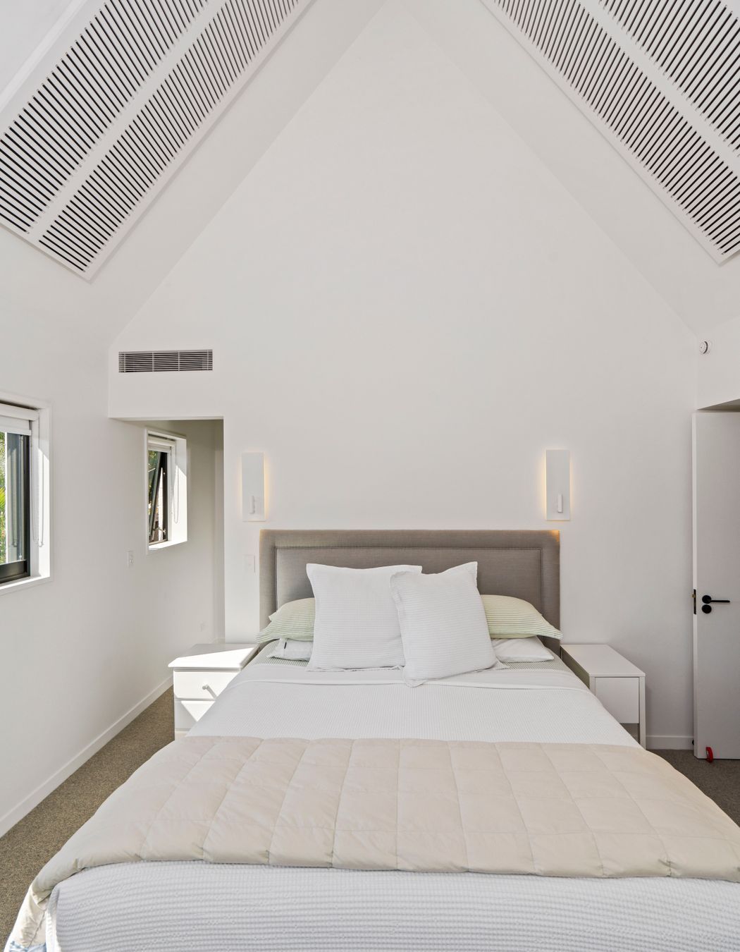 The main bedroom is a study in comfort with neutral tones providing a serene palette.