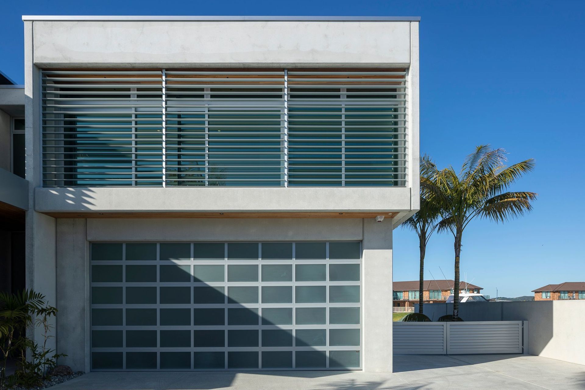 Boxed formations and concrete surfaces define this architectural build.