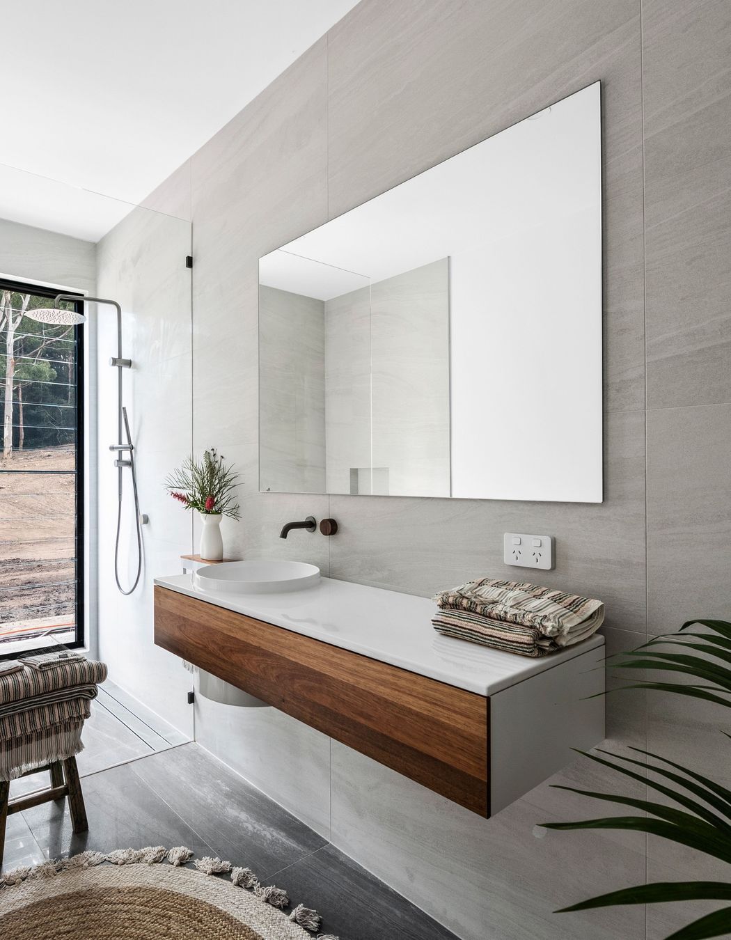 Raw and natural material finishes in the ground floor bathroom.