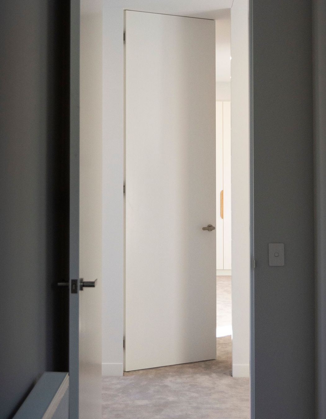 Double symmetrical photos  Two bedrooms leading through to one another across the hallway; both are EzyJamb SRC openings.