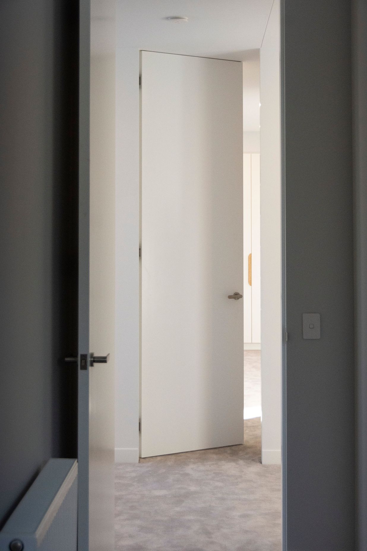 Double symmetrical photos  Two bedrooms leading through to one another across the hallway; both are EzyJamb SRC openings.