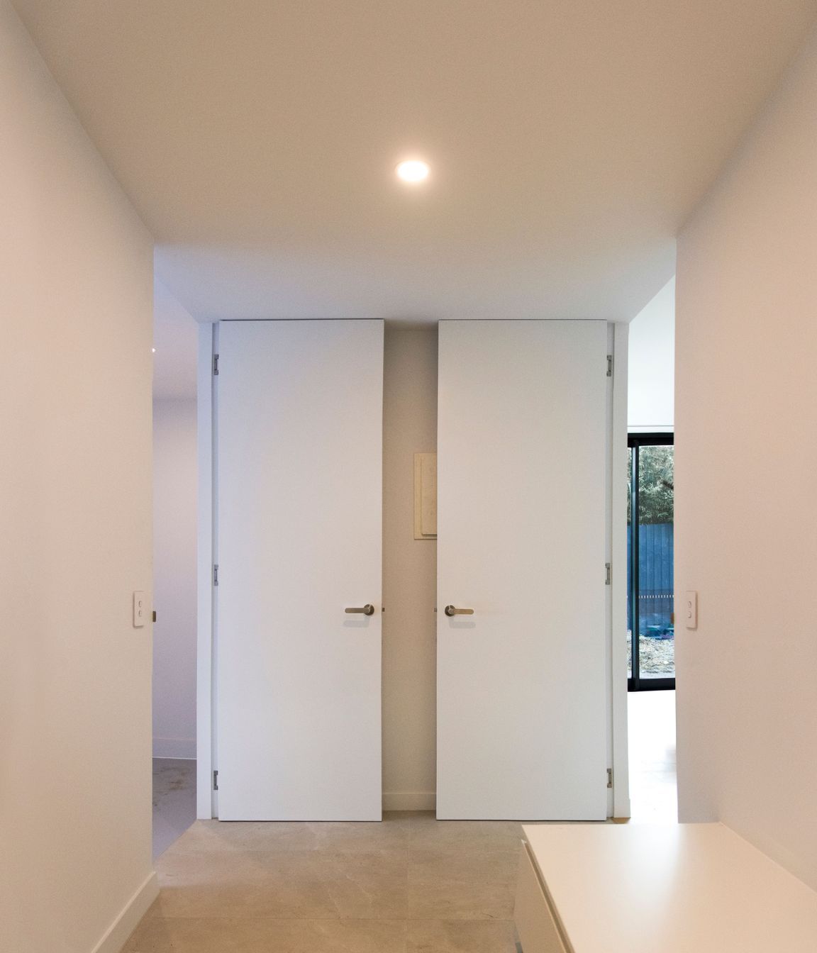 Two open EzyJamb framed doors in the home laundry.