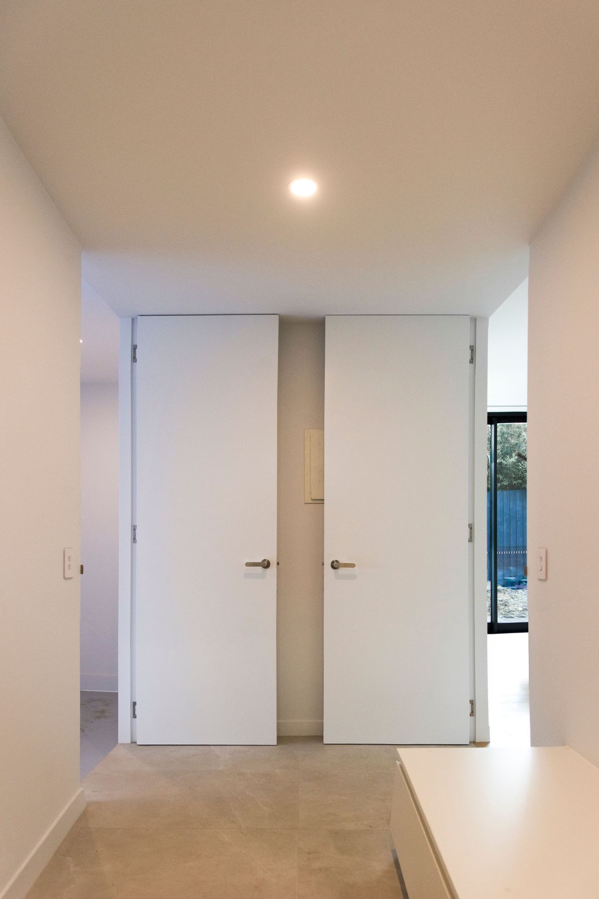 Two open EzyJamb framed doors in the home laundry.