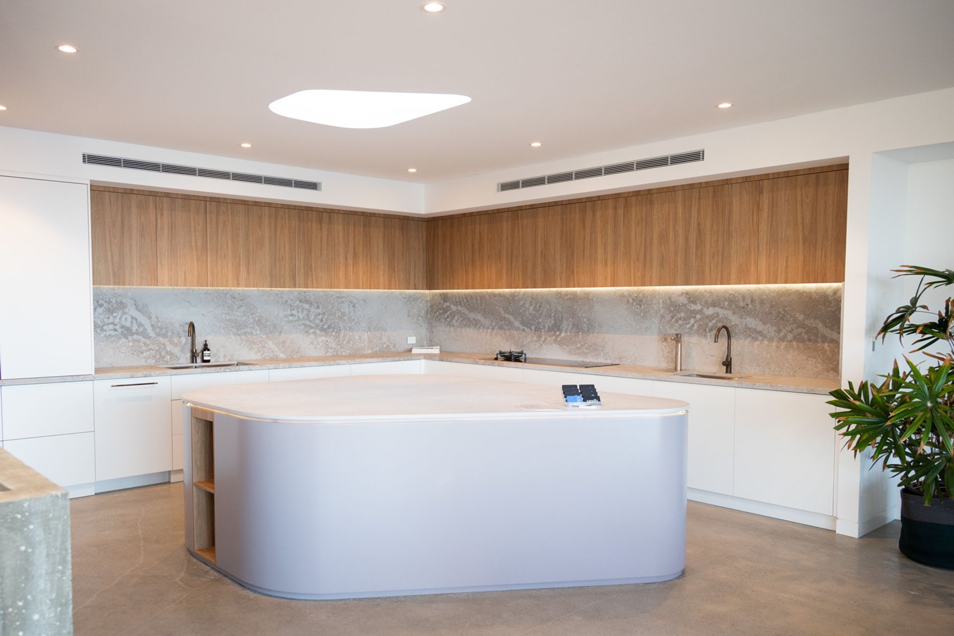 Muted tones and a spacious layout characterise the kitchen along with much of the house.