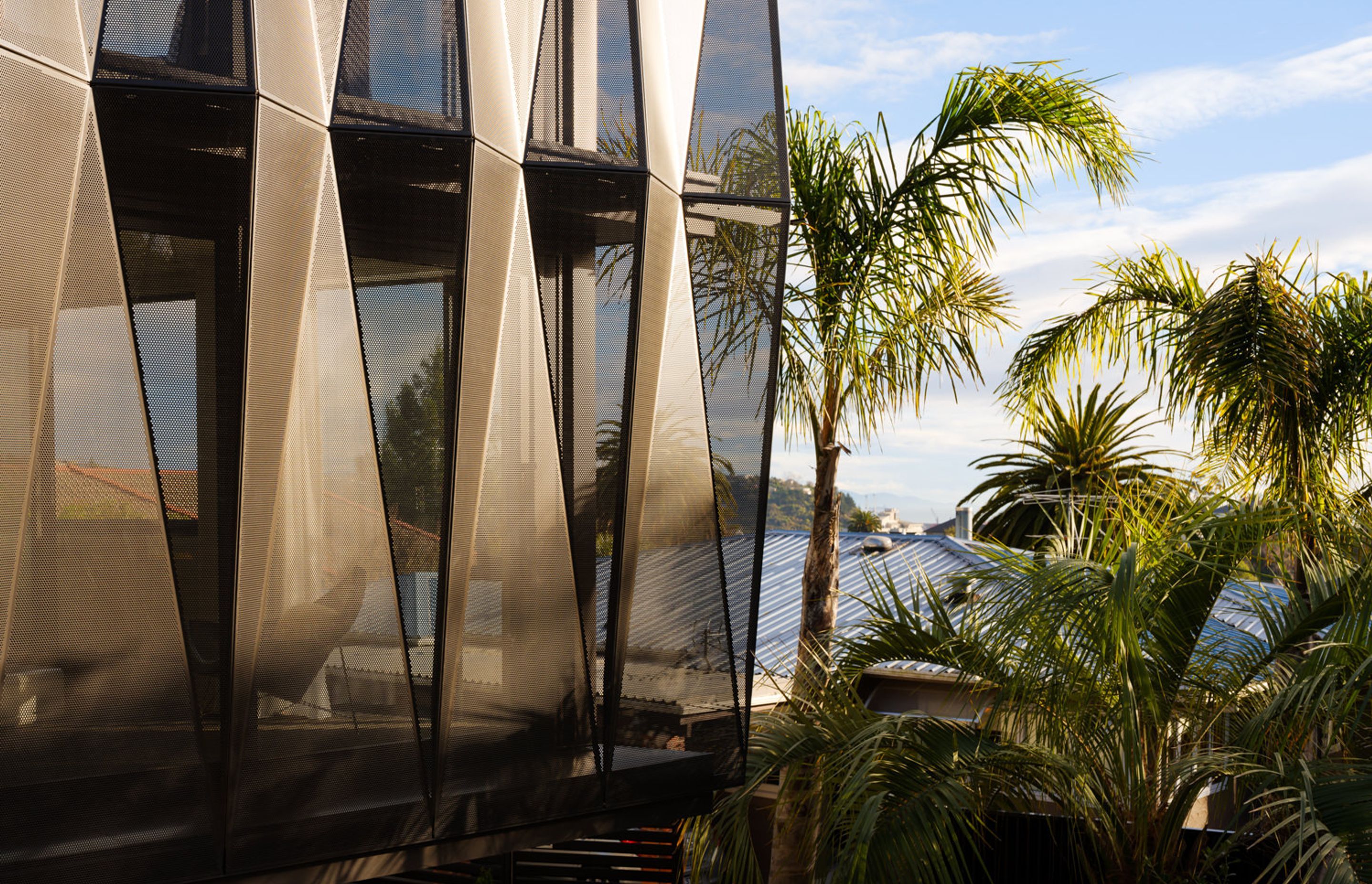 The fins also create an ever-changing play of light and shadow across the street-facing facade, providing a visual feast for passersby.