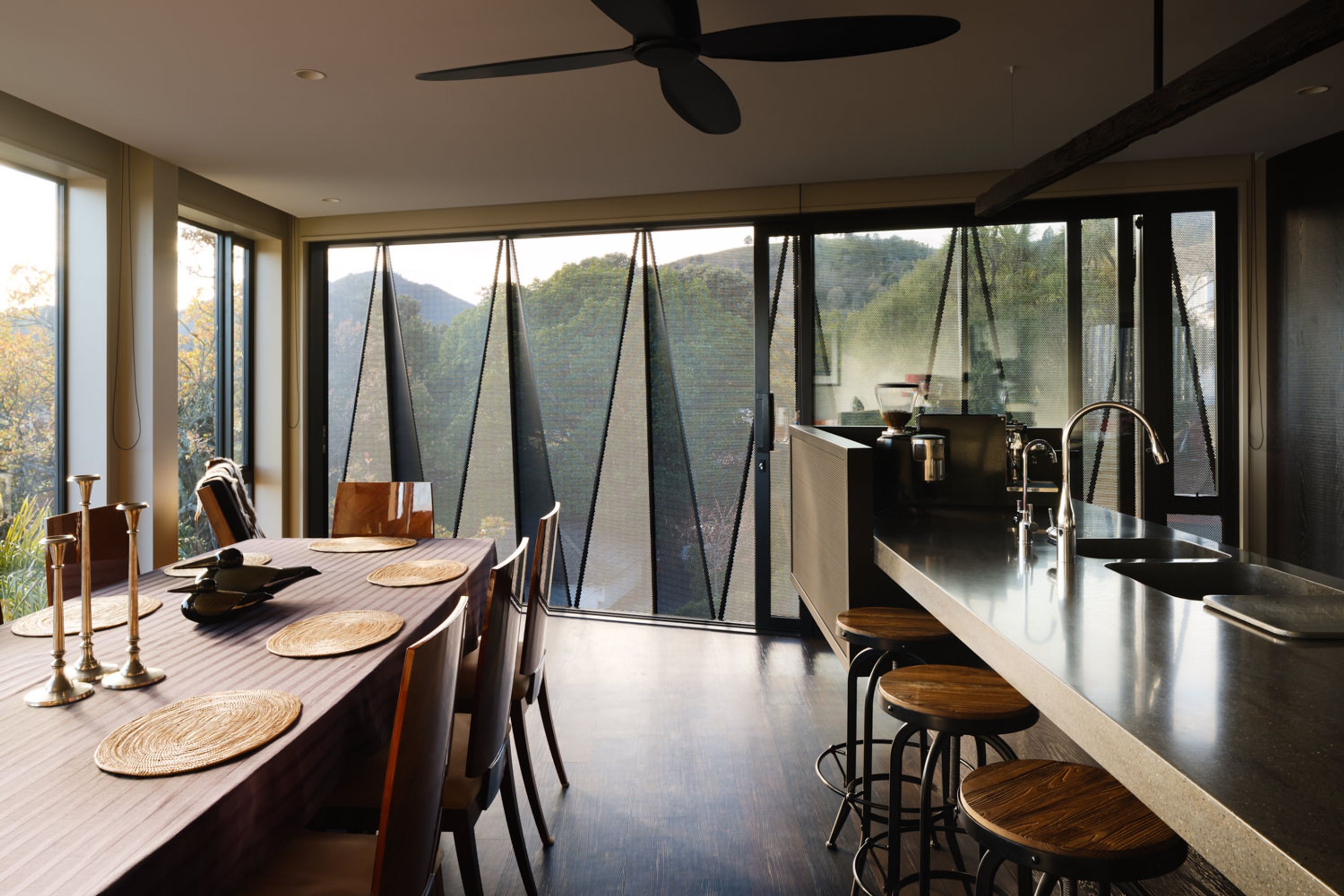 Like the exterior palette, the interiors draw heavily on dark, rich tones and charred oak joinery.