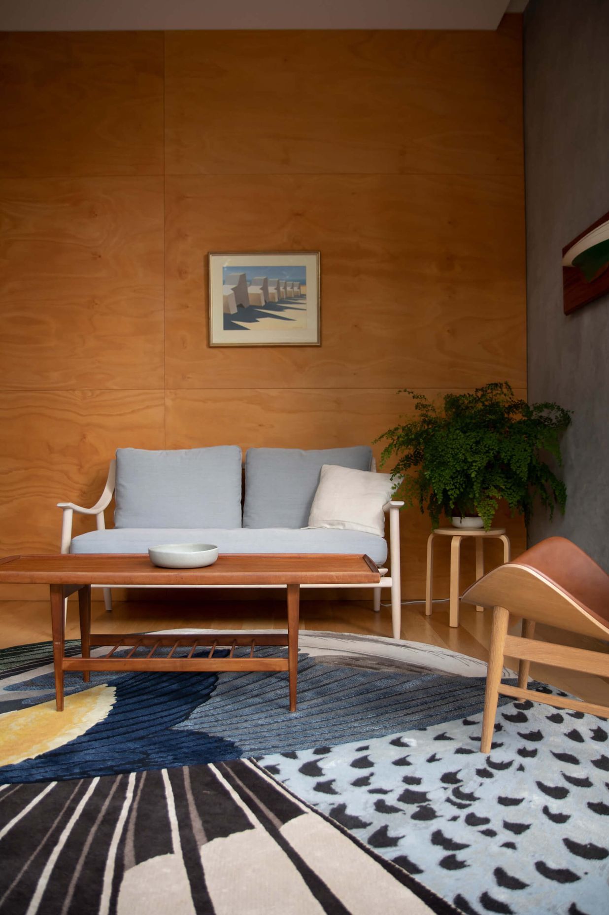Marino Sofa by Ercol, The Orange Armchair by Warm Nordi, Feathers Rug by CC-Tapis