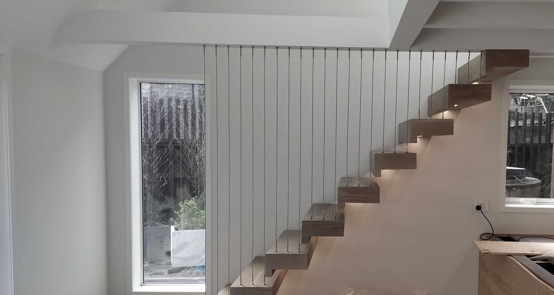 Floating stairs - residential wire balustrade infill banner