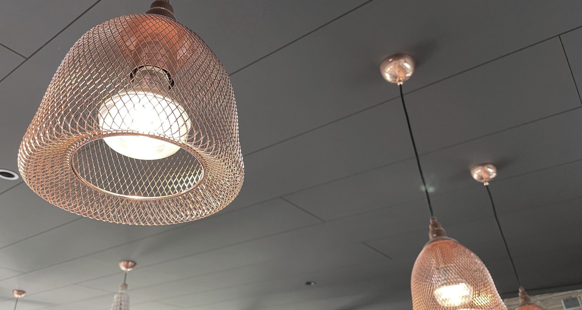 A bold black ceiling with Triboard TGV banner