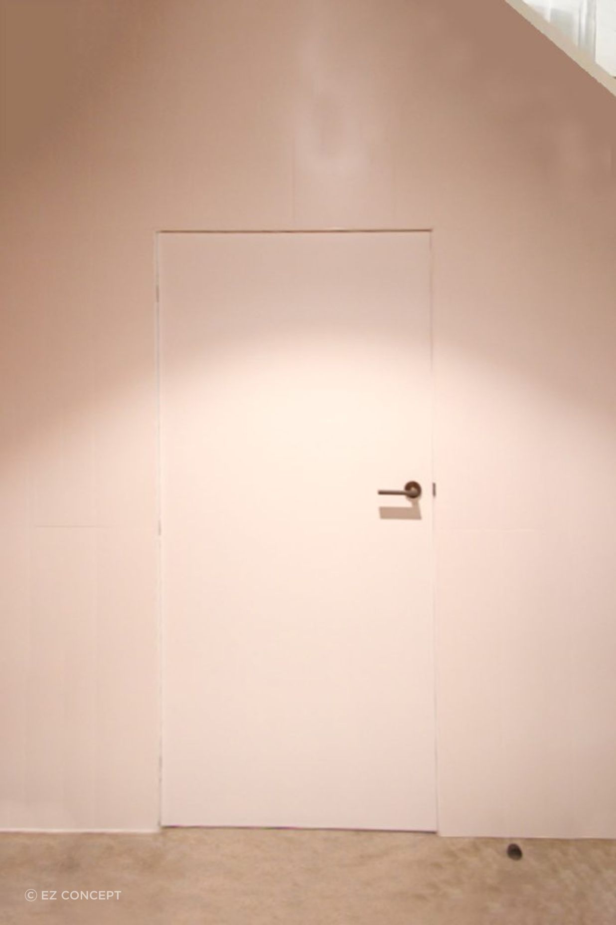A custom-sized storage door under the central staircase.