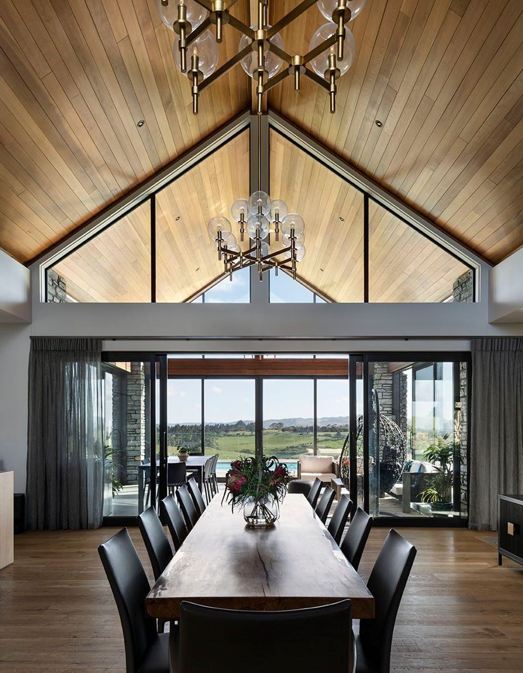 Vaulted cedar ceilings flow through to the conservatory with reflected clerestory windows.